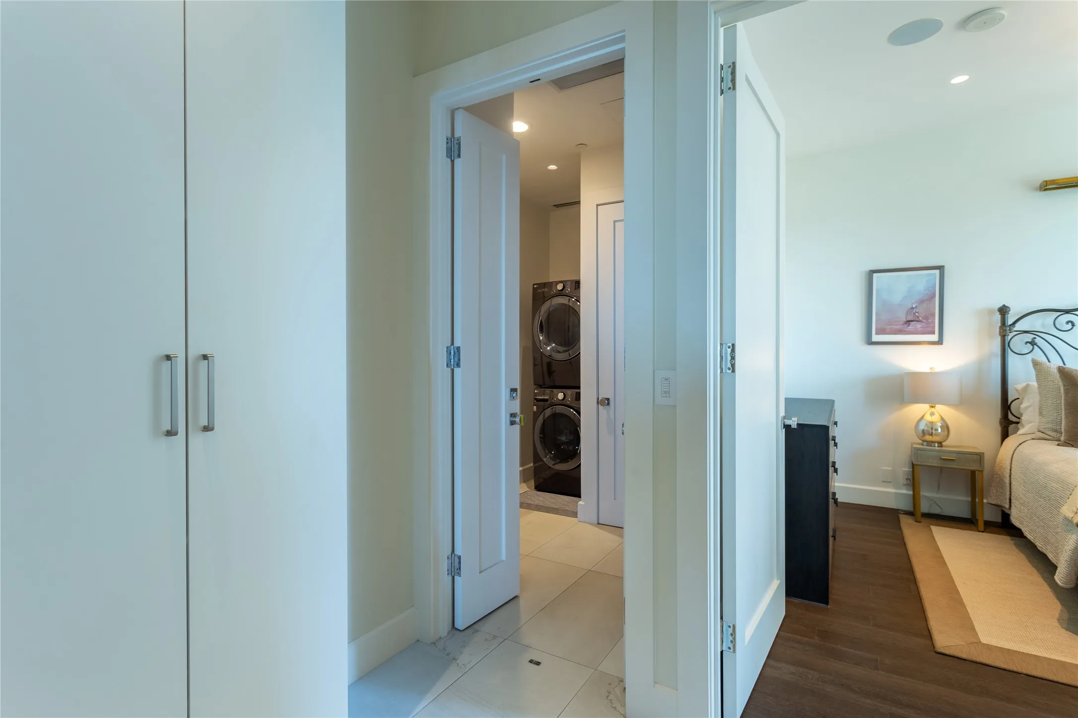 Full-size stack washer & dryer with outside storage.
