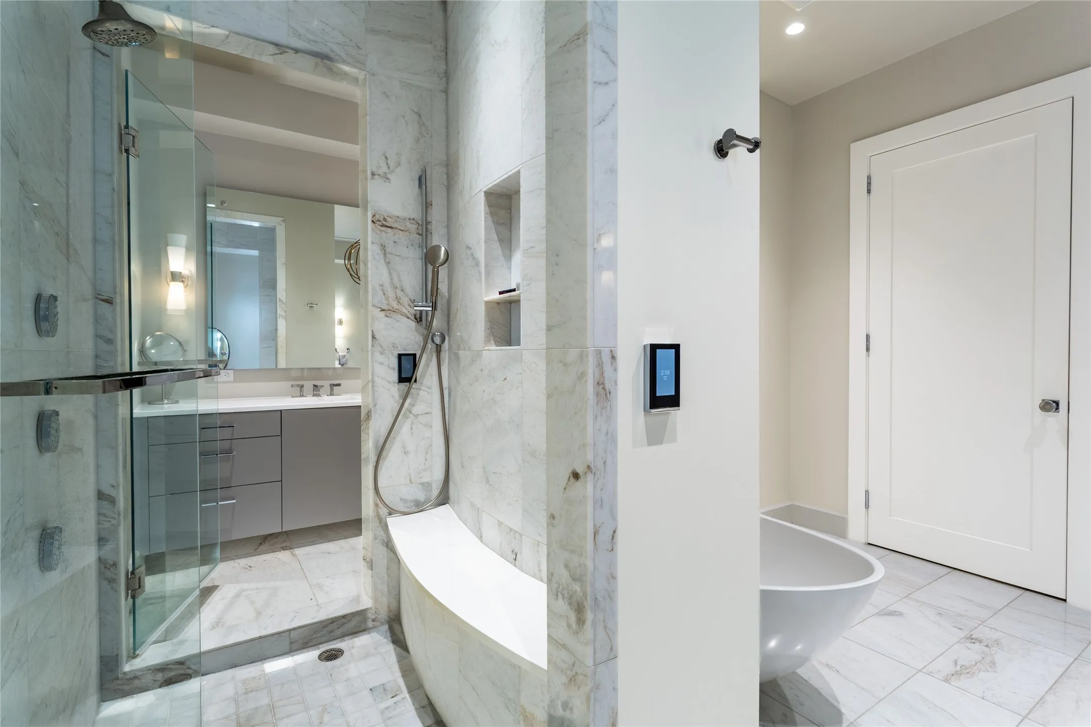 Dual digital control shower has customizable water temp & timing for up to 8 users.