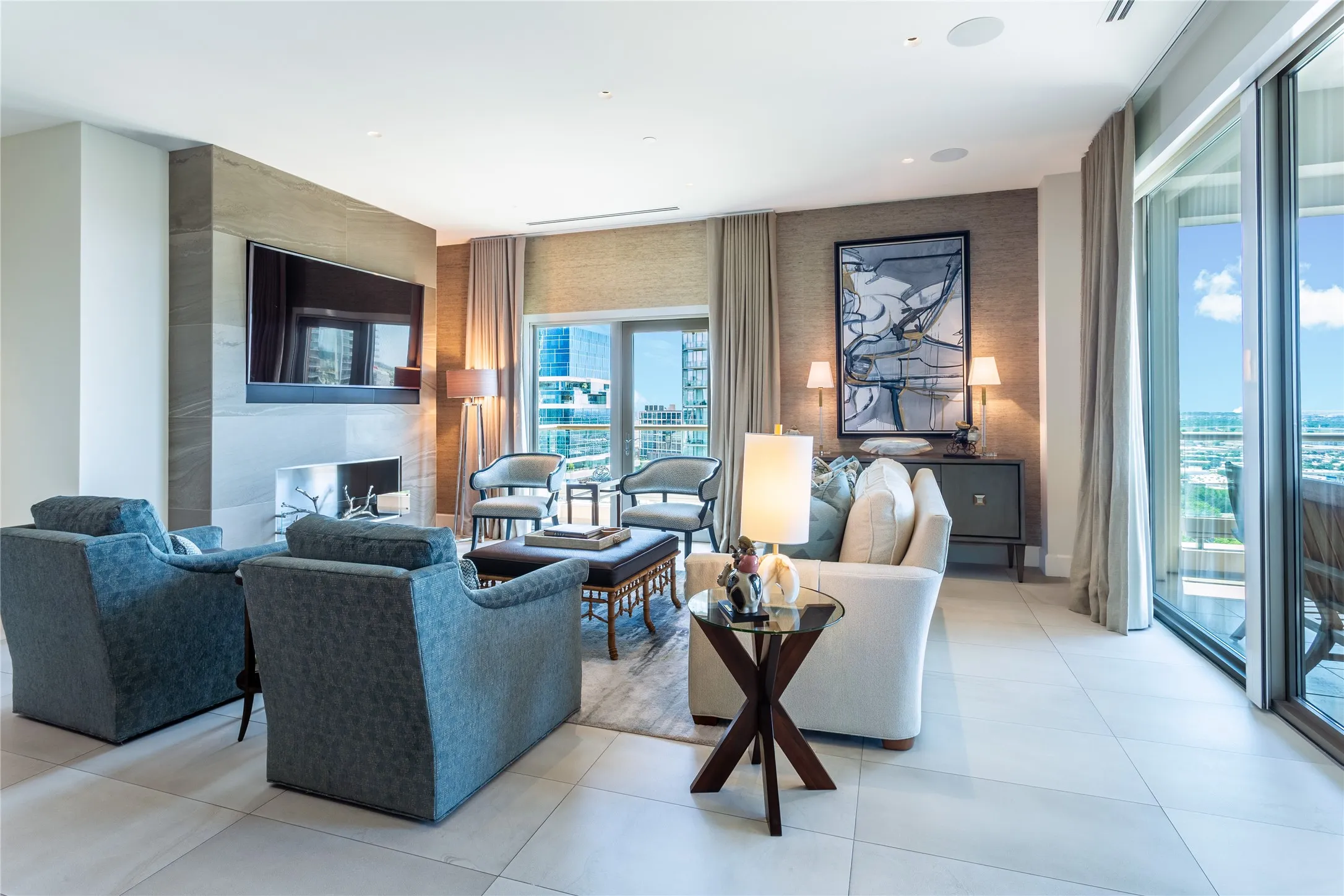 Living Room has Juliette Balcony with skyline views & large Balcony with sunset views.