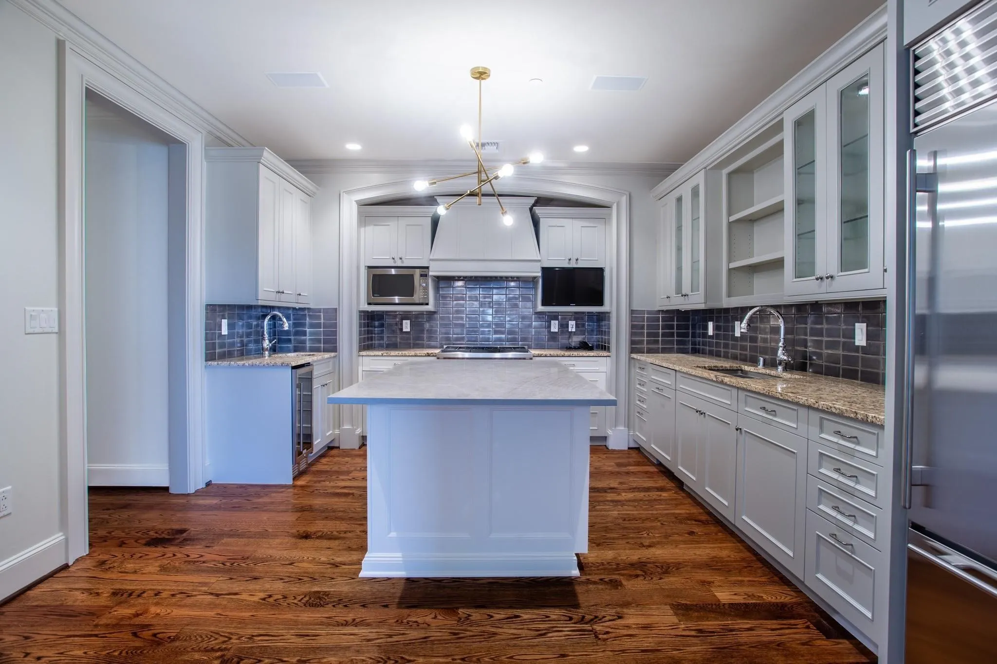 Island Kitchen with breakfast bar, second sink & wine cooler & large Pantry.