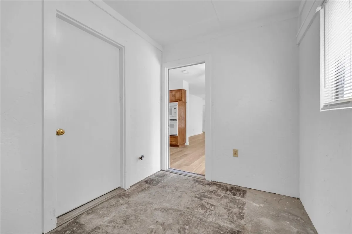 Mudroom coming in from garage with a separate door leading to the exterior