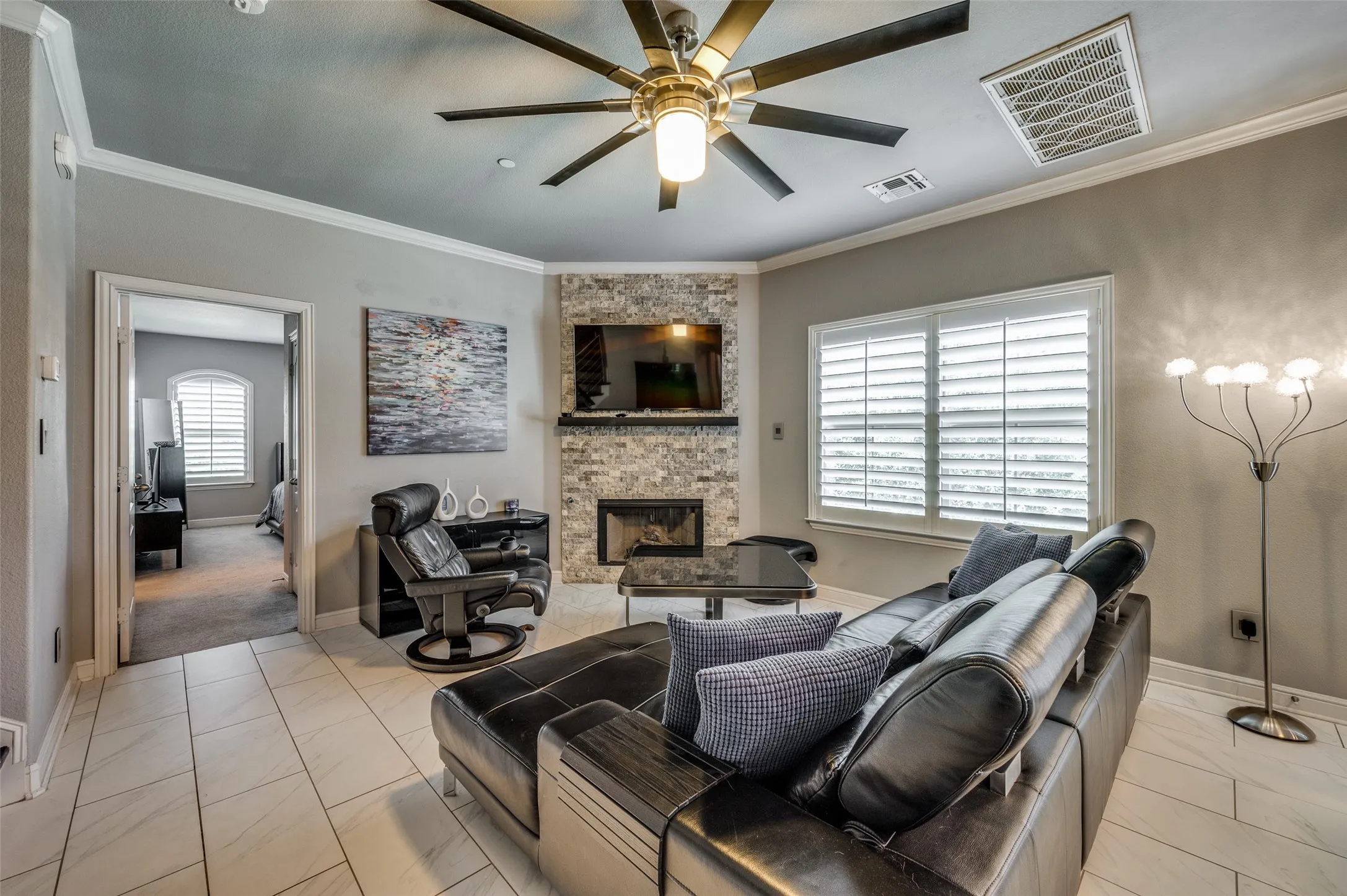 Open floor plan with beautiful tile flooring in living areas.
