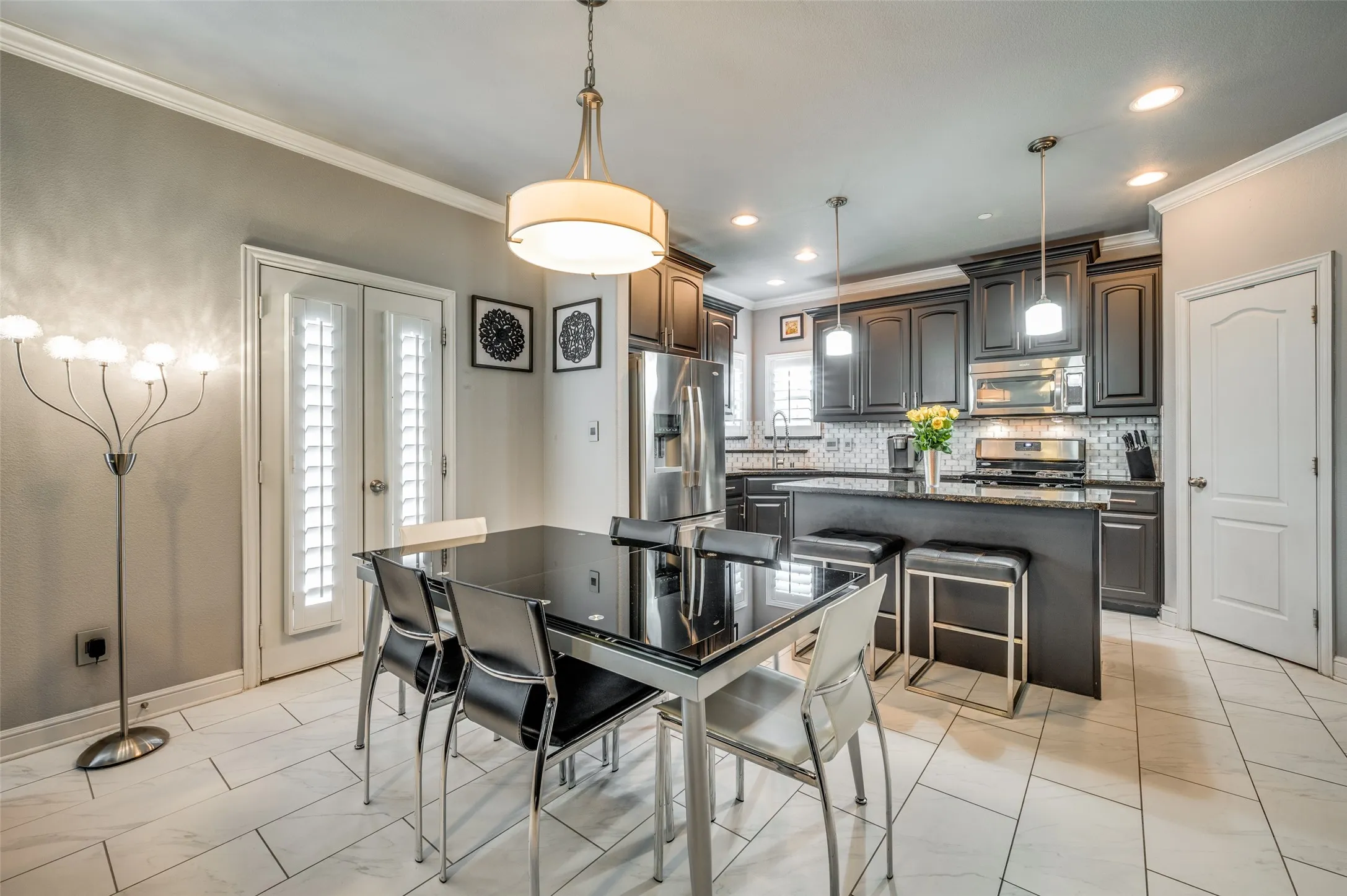Dining for two or celebrating with a crowd the dining area serves up versatility and style, with walk out Juliette balcony. Plantation Shutters through out