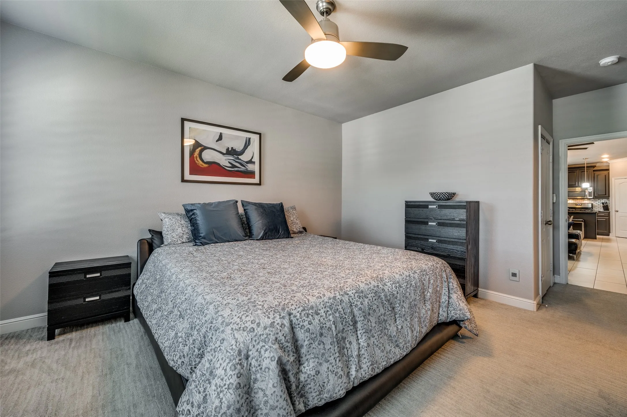 Primary bedroom with view of his and hers  walk in closet and large bathroom