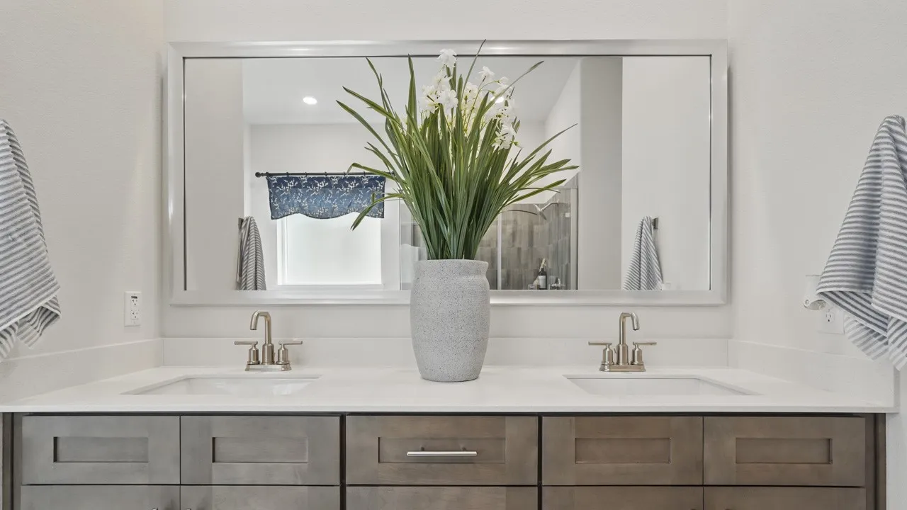Double vanity featuring under-mount sinks and brushed nickel faucets