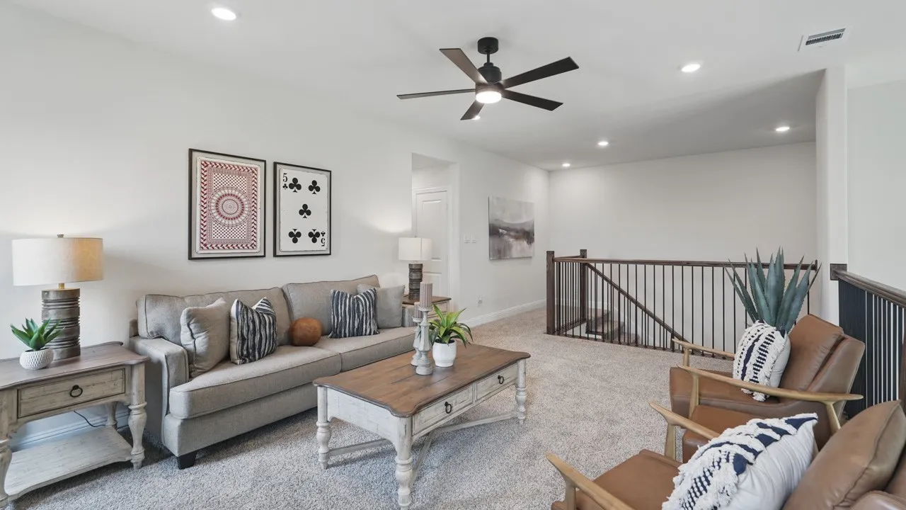 Open concept upper level featuring plush carpeting, recessed lighting, and a contemporary ceiling fan