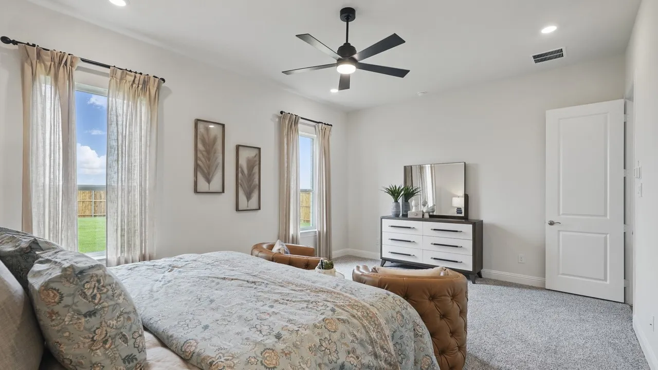 Spacious room featuring multiple windows with natural light, recessed lighting, a ceiling fan, and carpet flooring