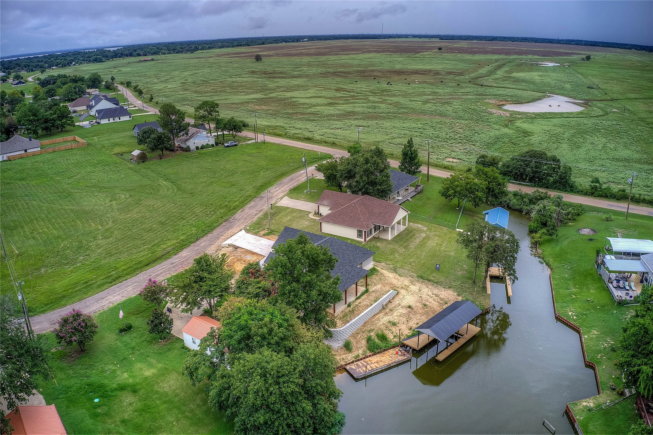 Bird's eye view with a water view and a rural view