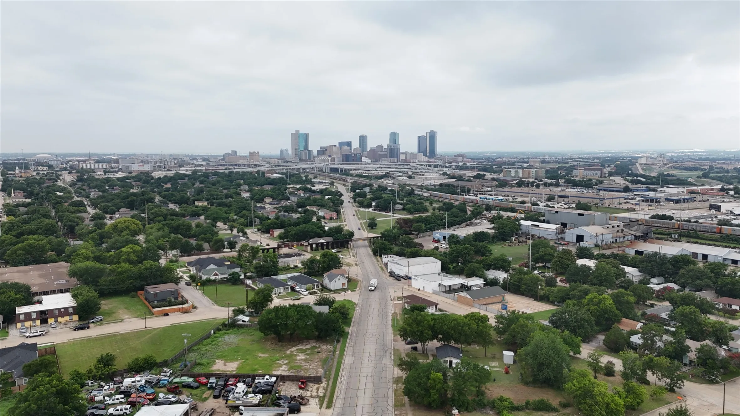 Expansive aerial perspective showcasing a cityscape with a prominent skyline