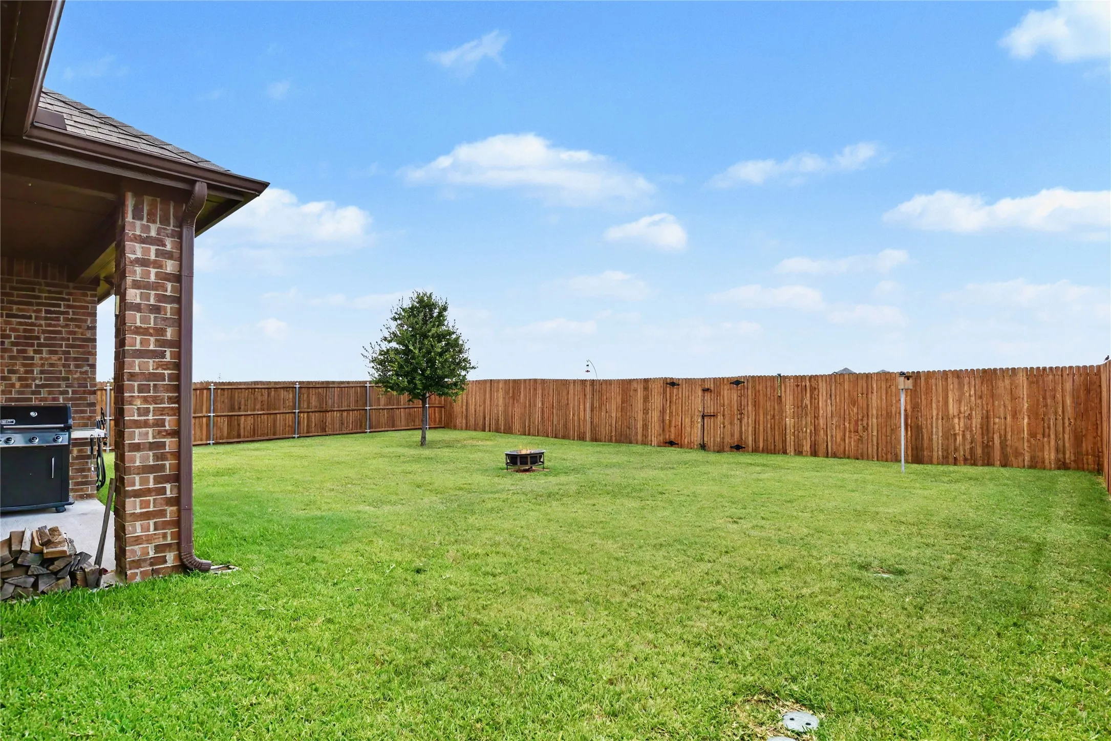 Backyard barbecues with greenbelt privacy.