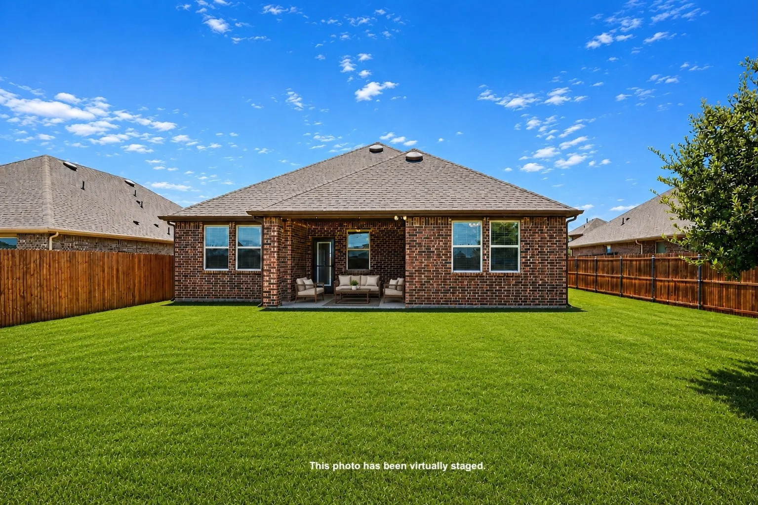 The spacious backyard backs to a greenbelt, creating a private outdoor retreat rarely found at this price point.