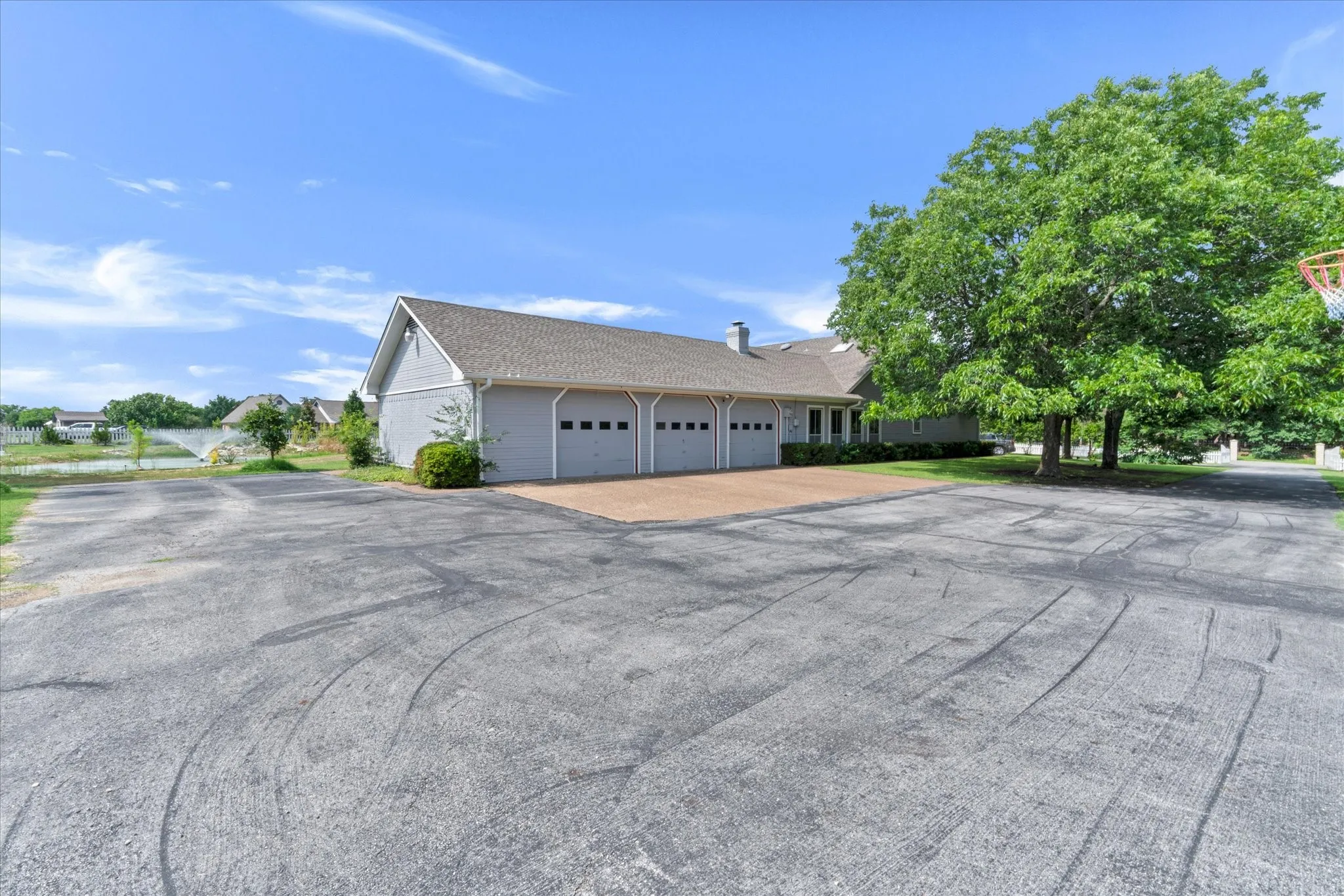 huge asphalt driveway with expansive room for parking