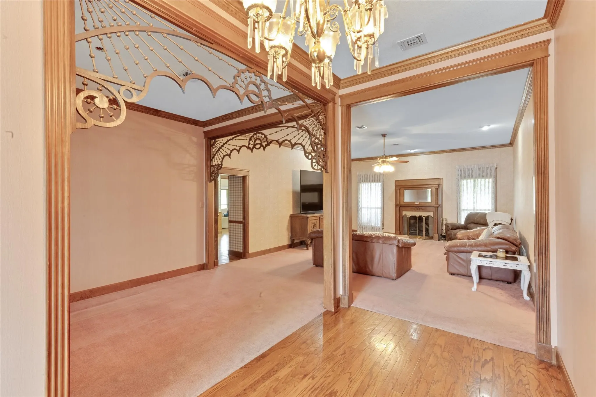 Hardwood floors in entry with crown moulding