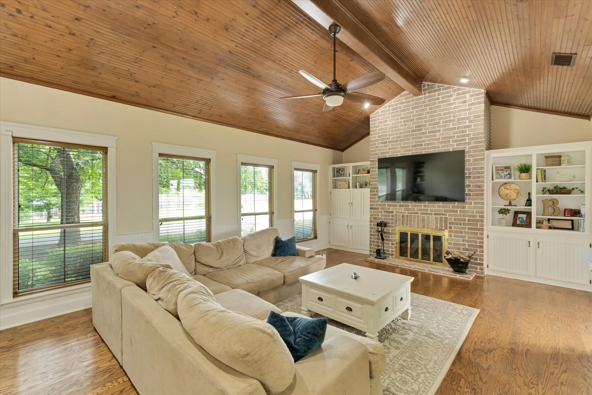 Vaulted wood-paneled ceiling with exposed beam