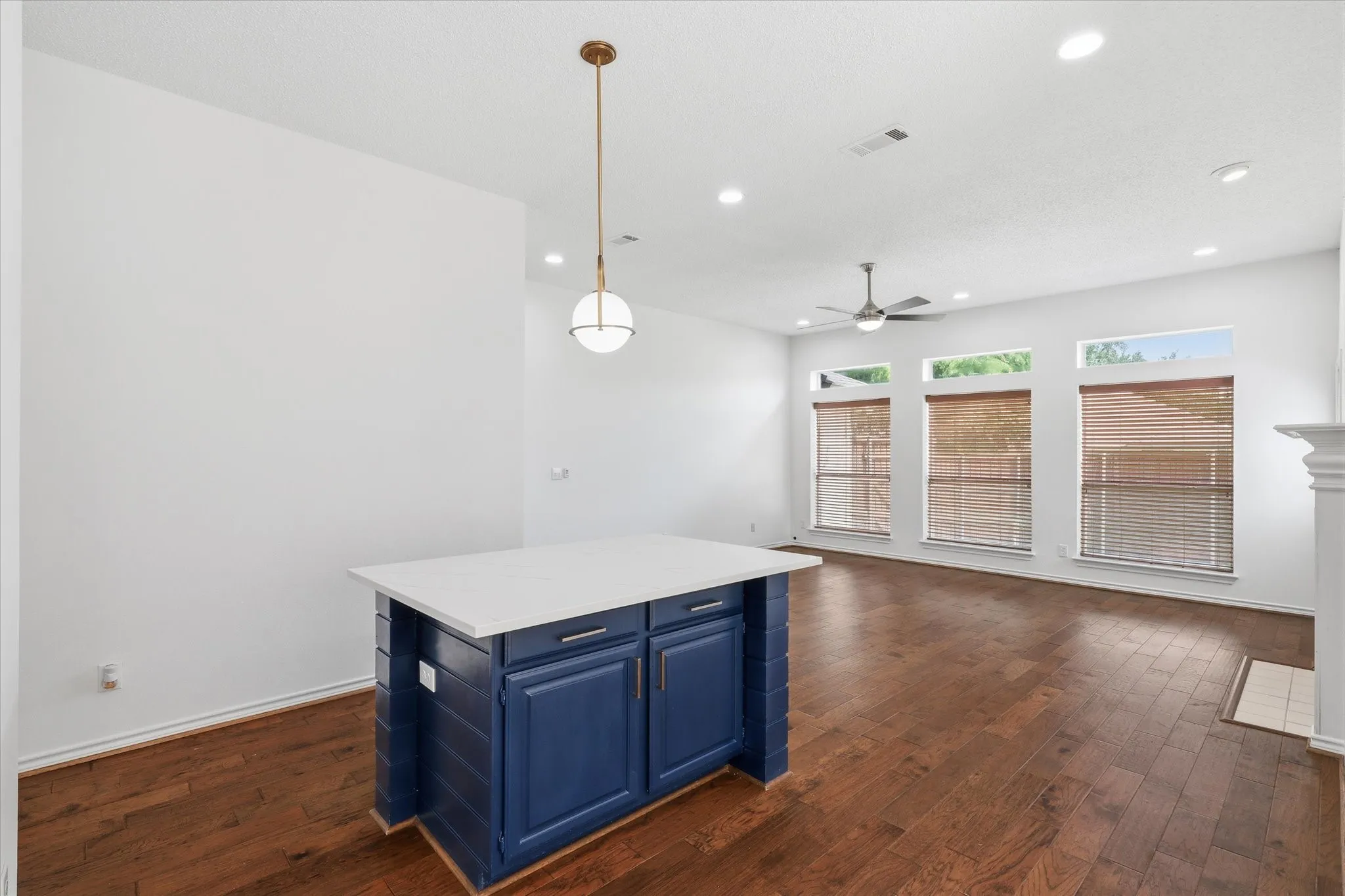 The Family Room is nicely sized with wood floors and a wood burning fireplace.