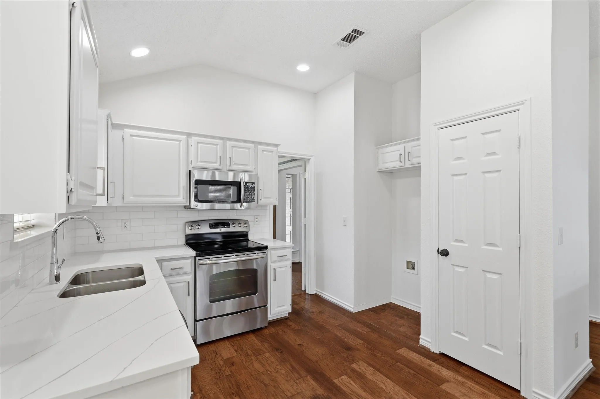 The Kitchen has updated quartz countertops.