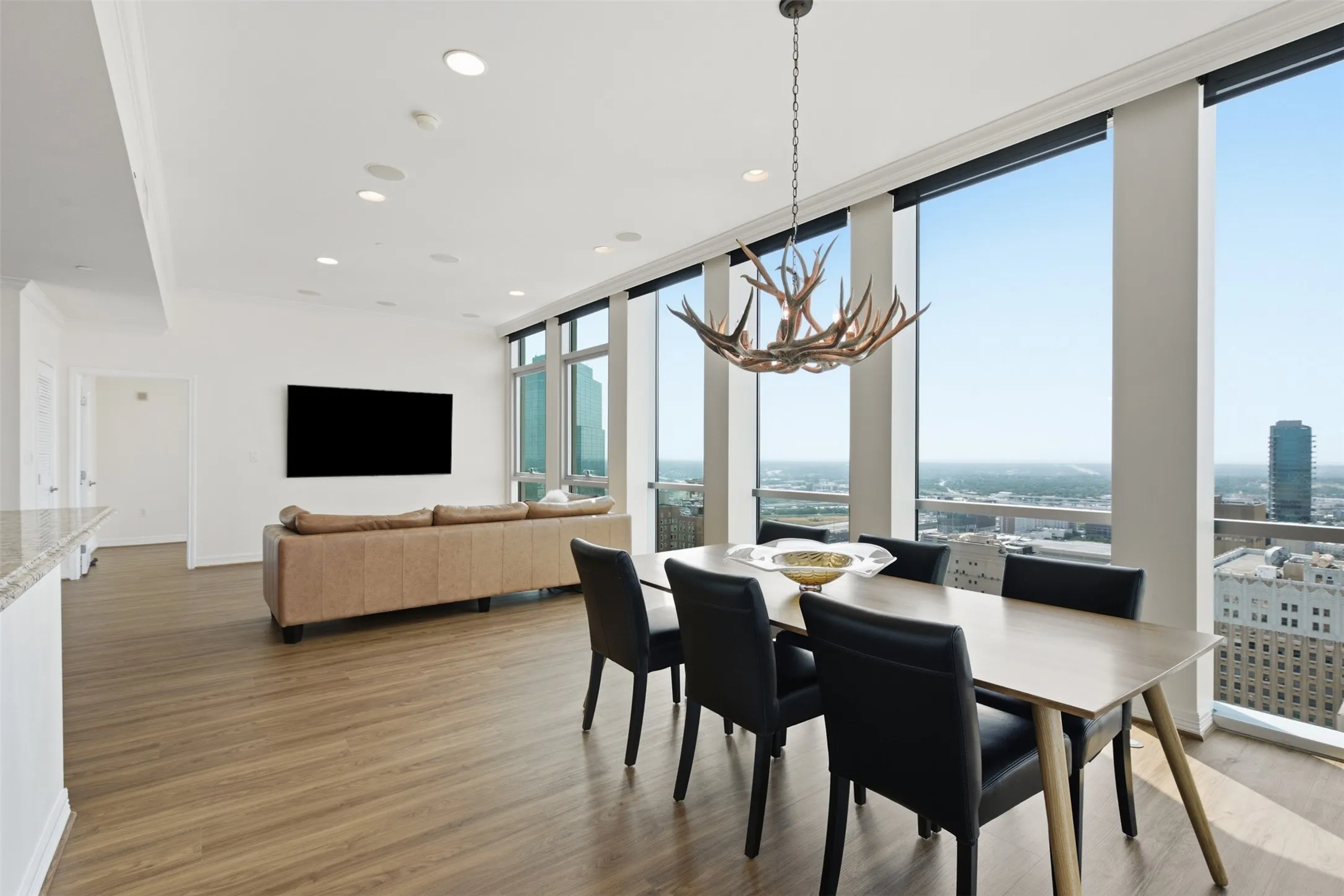 Open-concept living area with extensive floor-to-ceiling windows