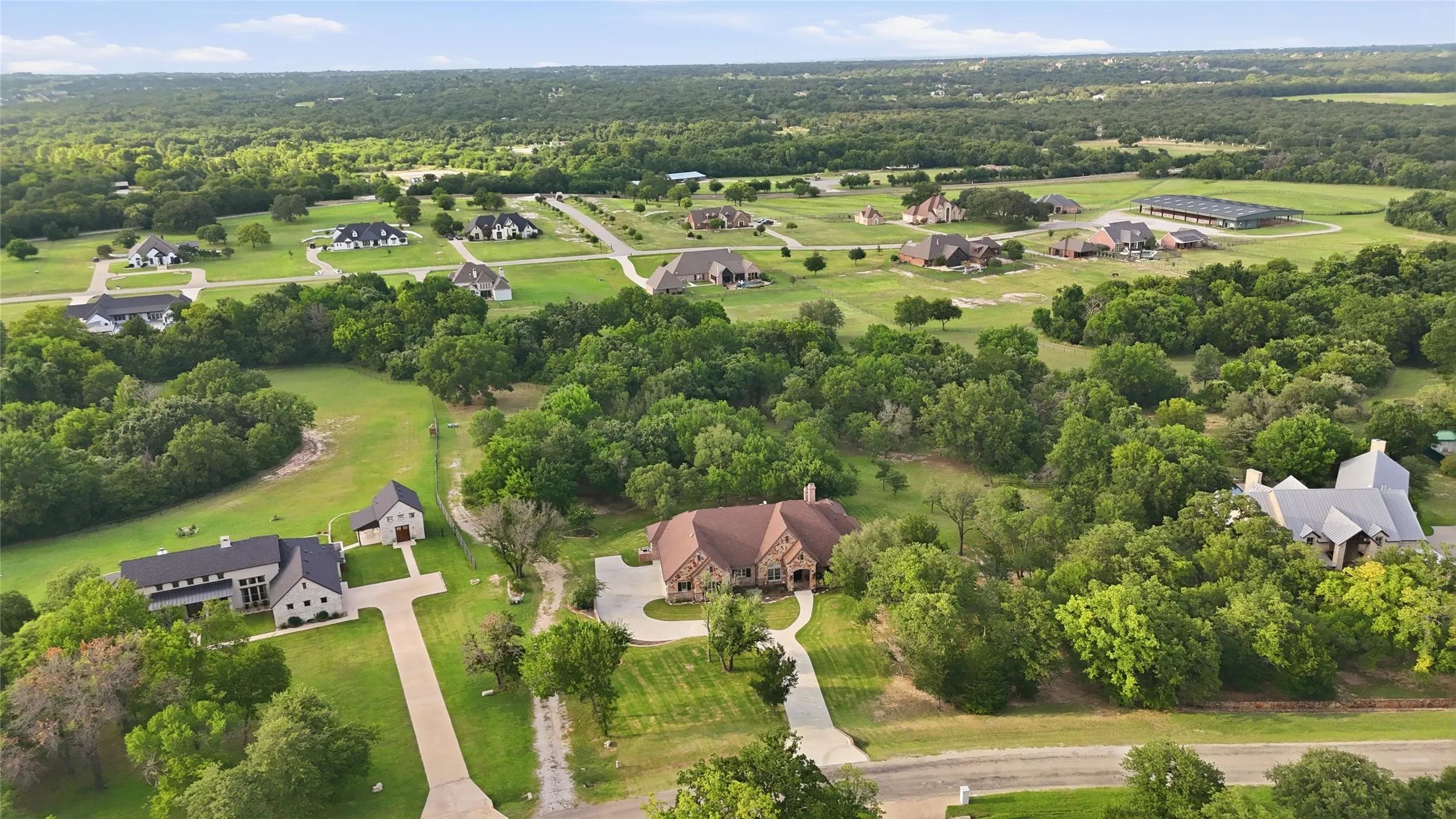 Aerial perspective showcasing a residential community with expansive properties