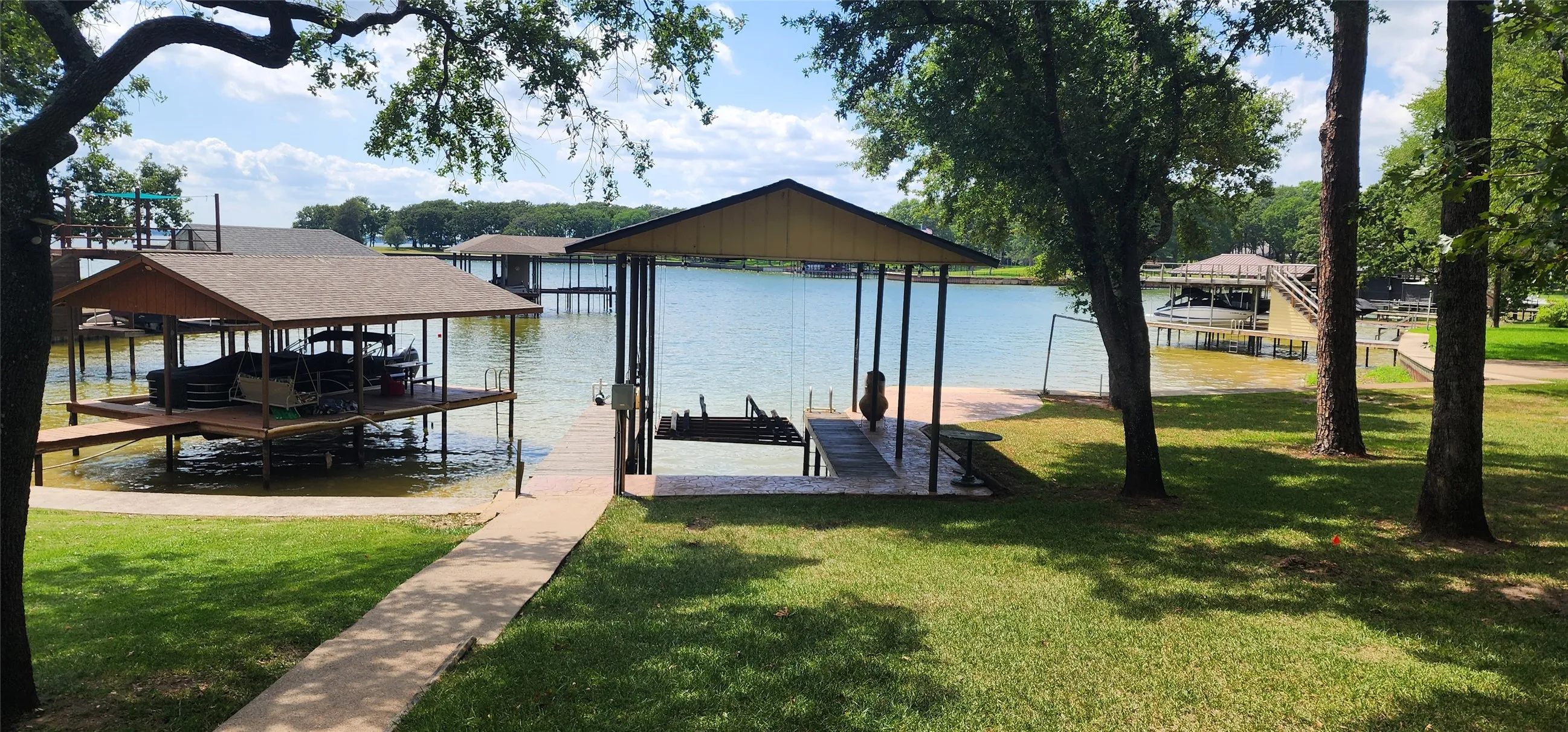 Single slip boathouse has a pontoon cradle.