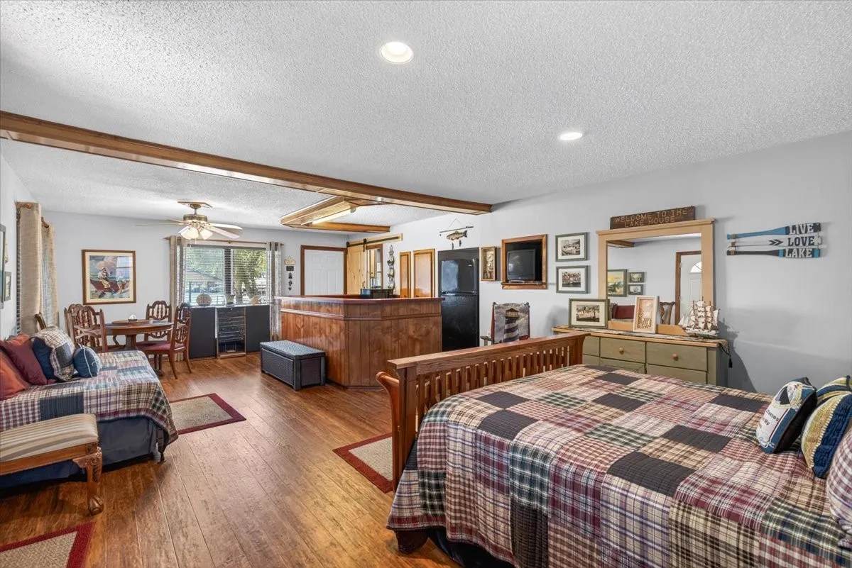 The guest quarters built in 1970 with 653SF. Tremendous possibility for open living-dining-sleeping, gameroom, office or mother in law suite and includes a full bath and kitchenette.