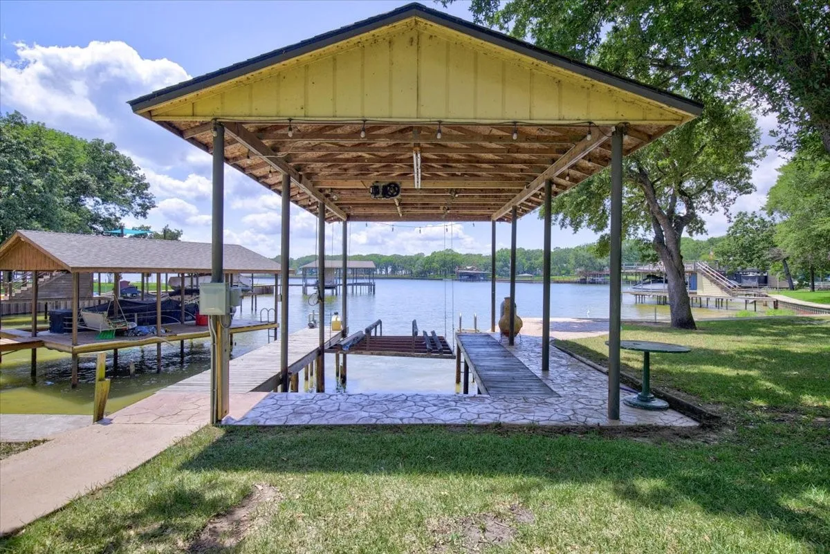Single slip boathouse has a pontoon cradle.