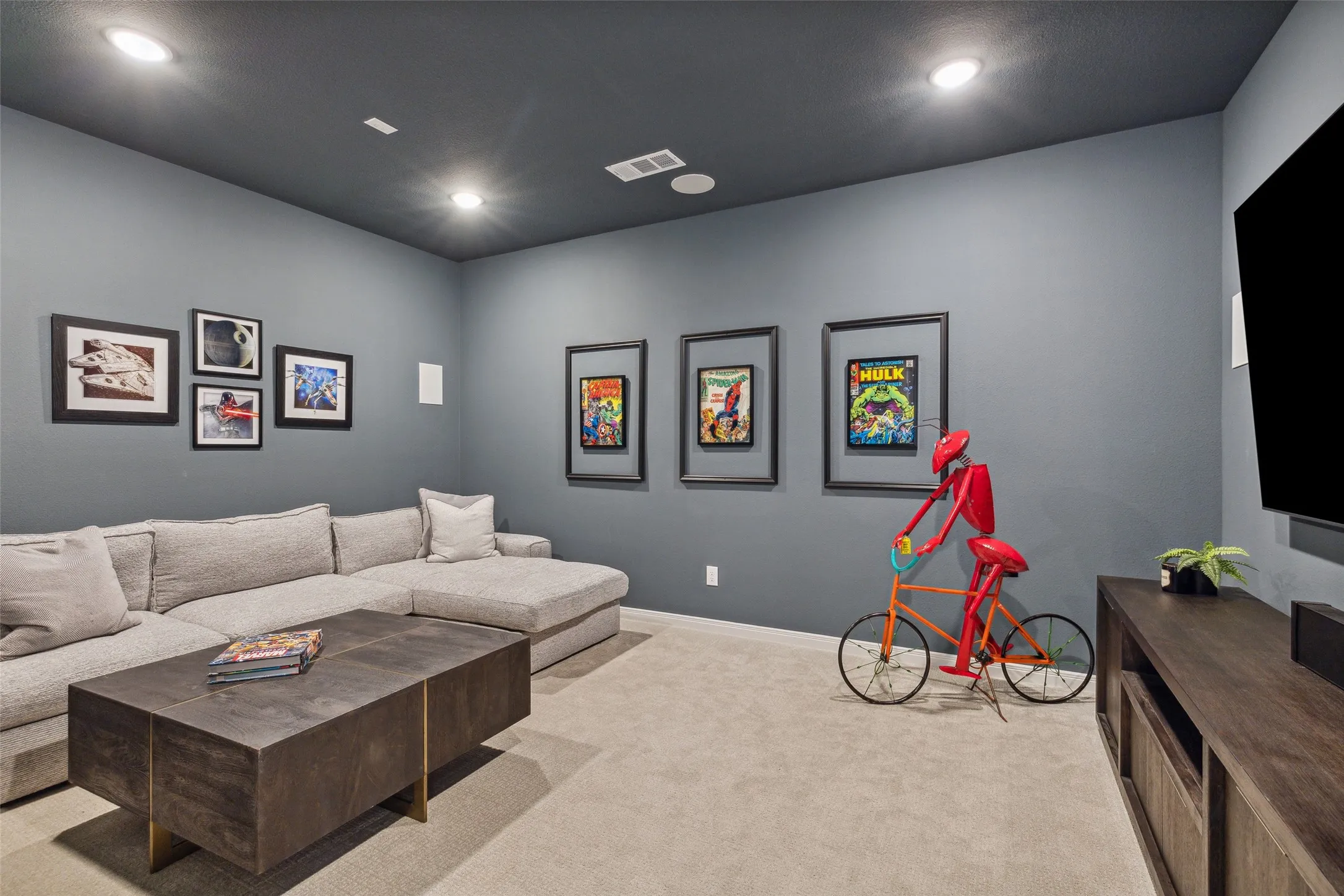 This spacious media room and adjacent game room create the ultimate family entertainment zone.