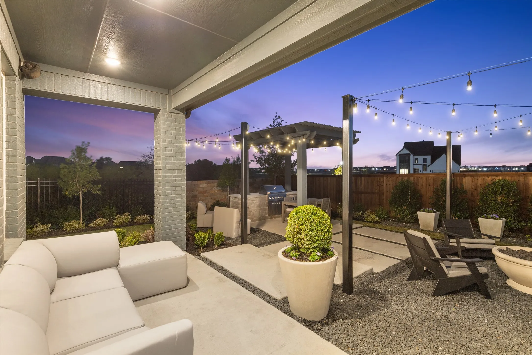 Featuring a spacious covered back patio and outdoor kitchen, you will enjoy hosting family bbq's all summer long!