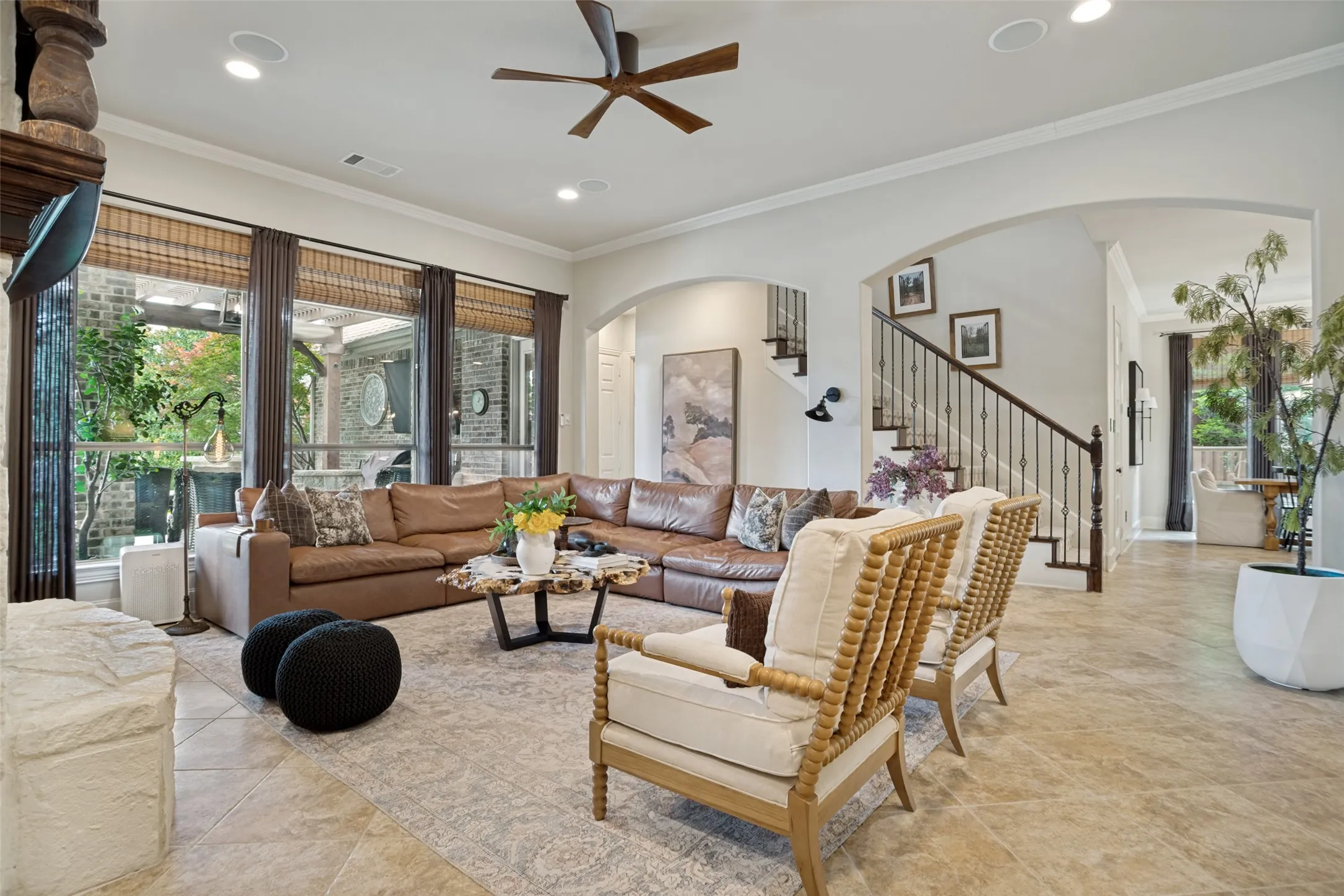 Large, main living room with space to spread out.  Stone fireplace and wooden built-in cabinets.  Custom electric blinds.