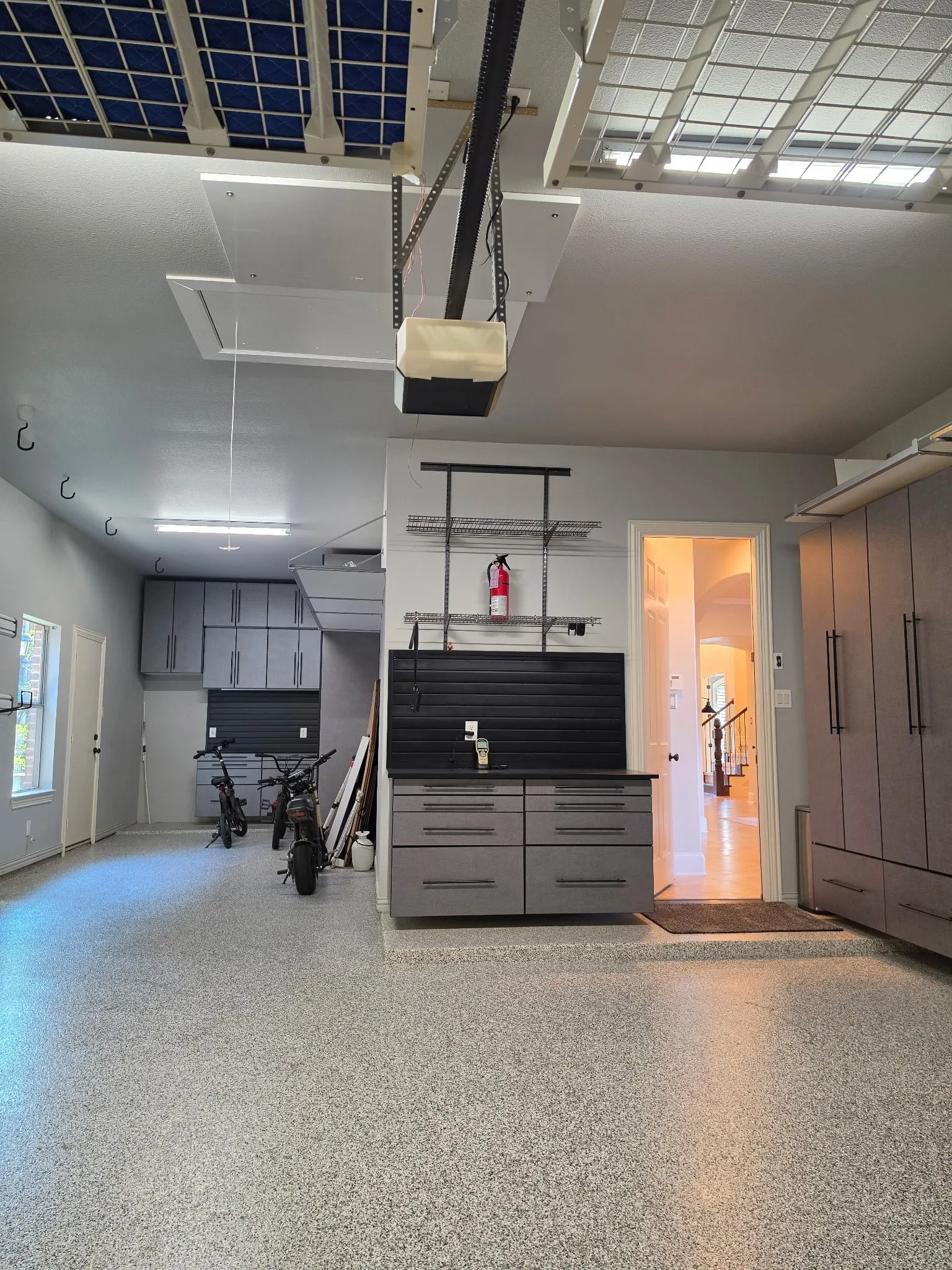 Spacious 3-car tandem garage with epoxy floor and abundant storage