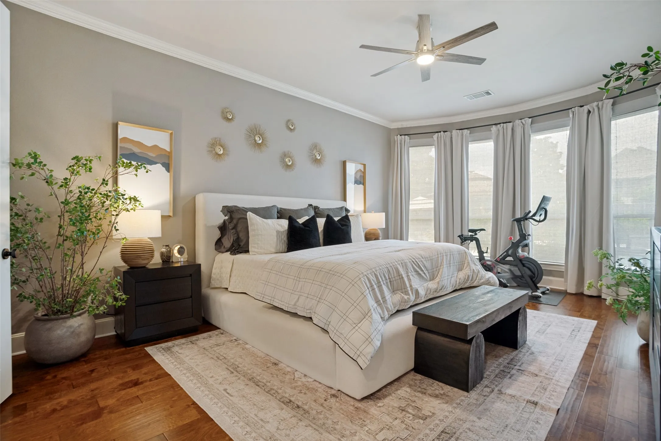 First floor spacious primary suite with wood floors and blackout shades