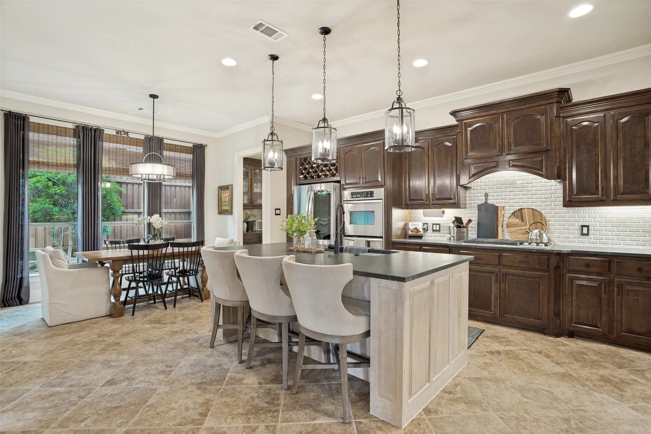 Updated kitchen with stained hardwood cabinets, new backsplash, new island and quartzite countertops