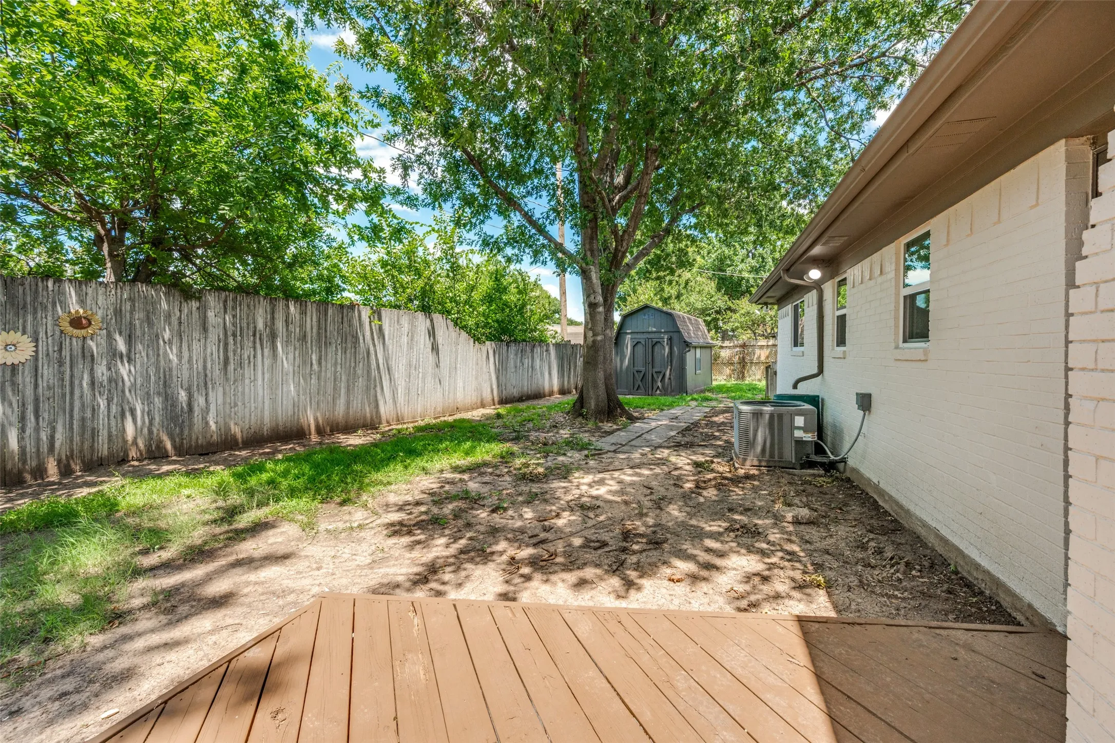 Private backyard with a wood deck patio