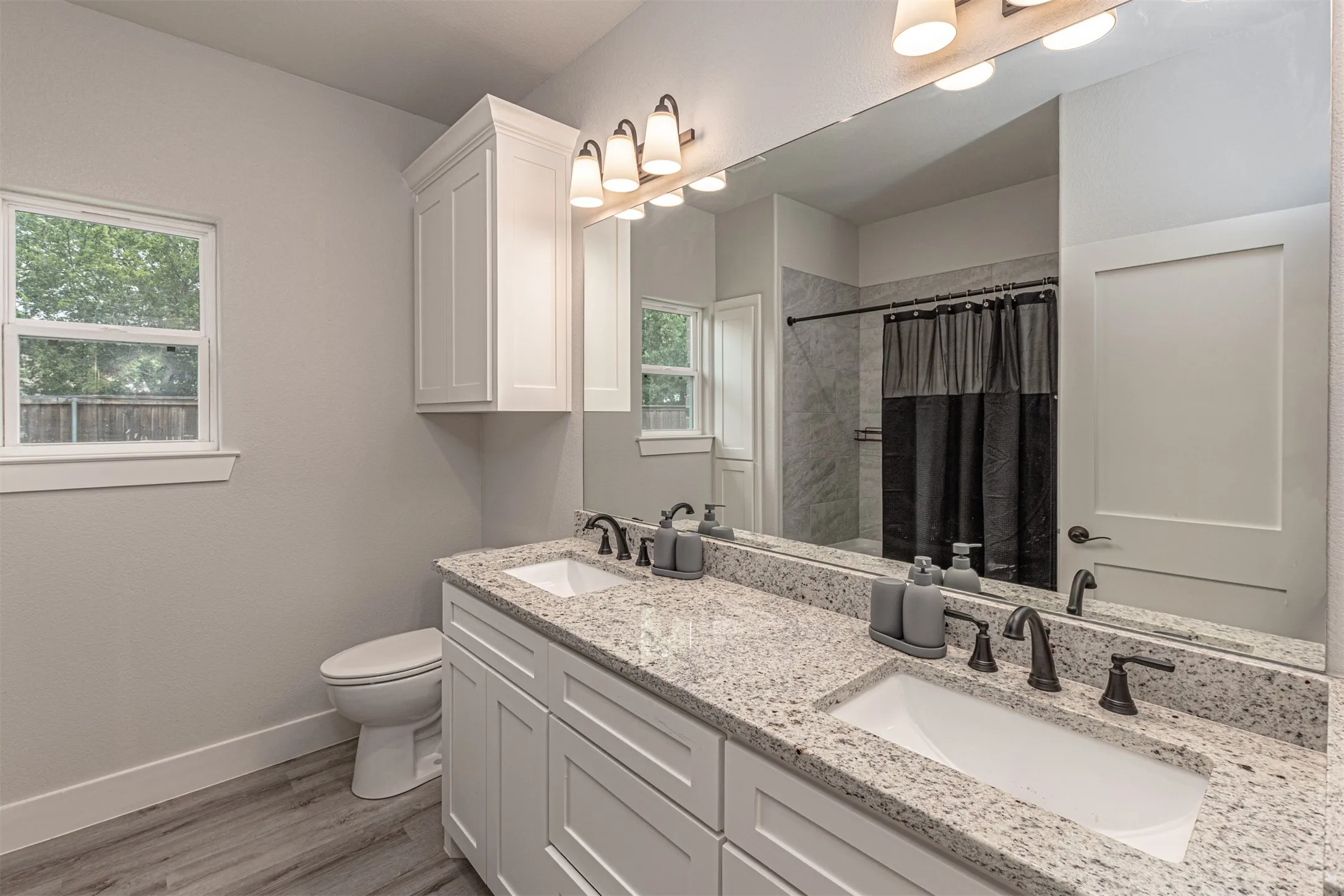 Dual vanity with granite countertops and integrated sinks