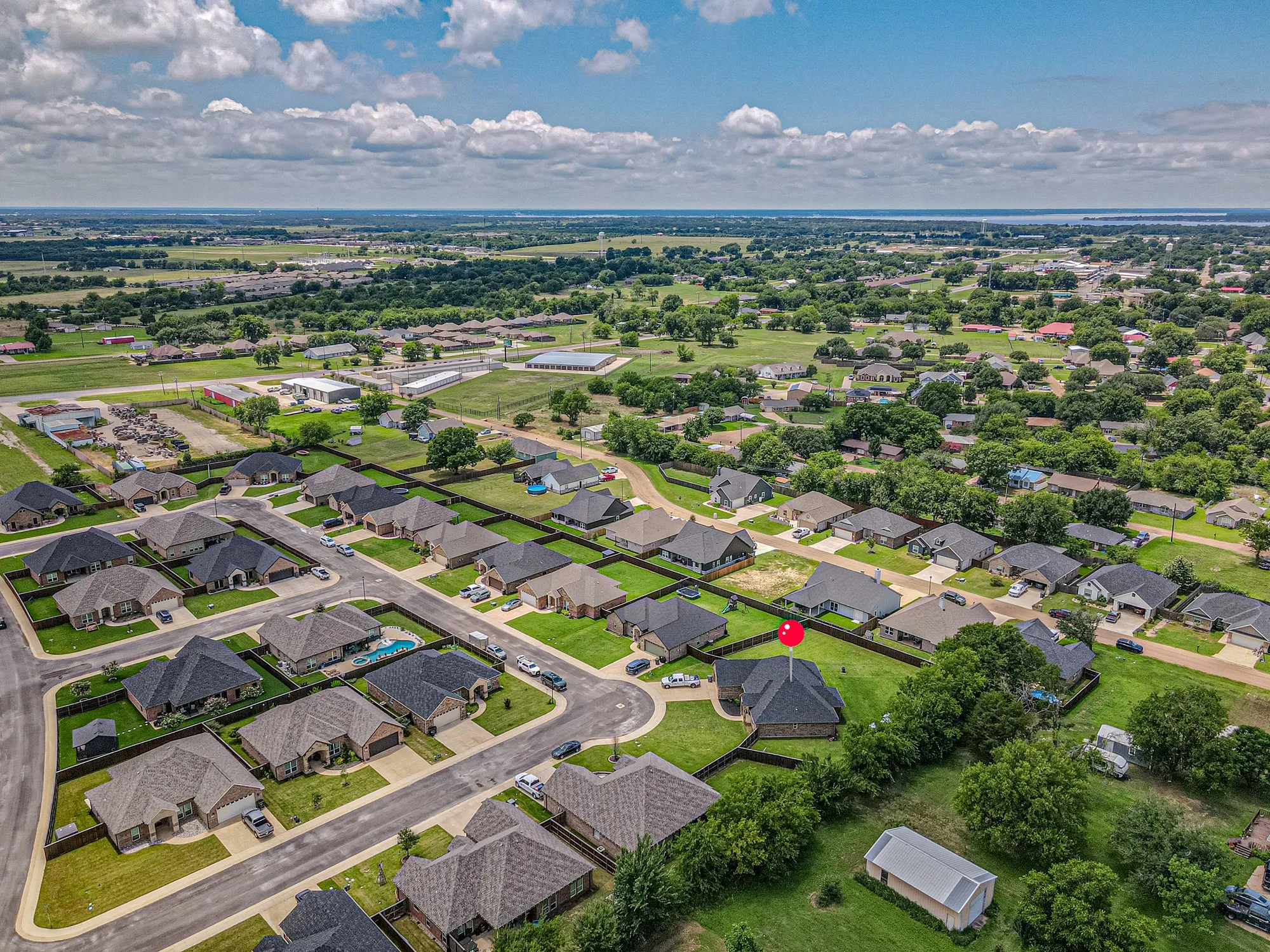 Aerial perspective showcasing the residential neighborhood with a variety of single-story homes