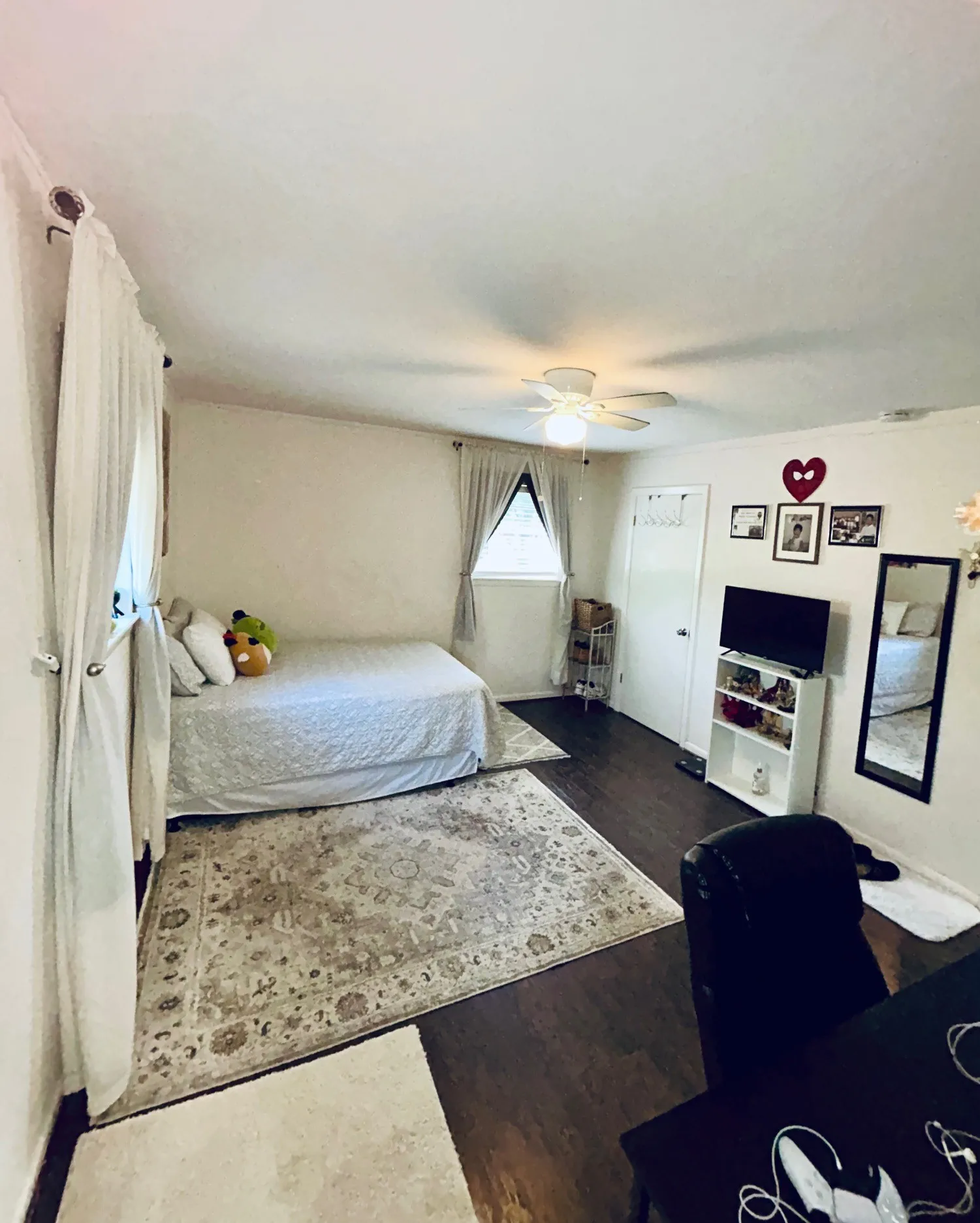 Bedroom with wood finished floors and ceiling fan