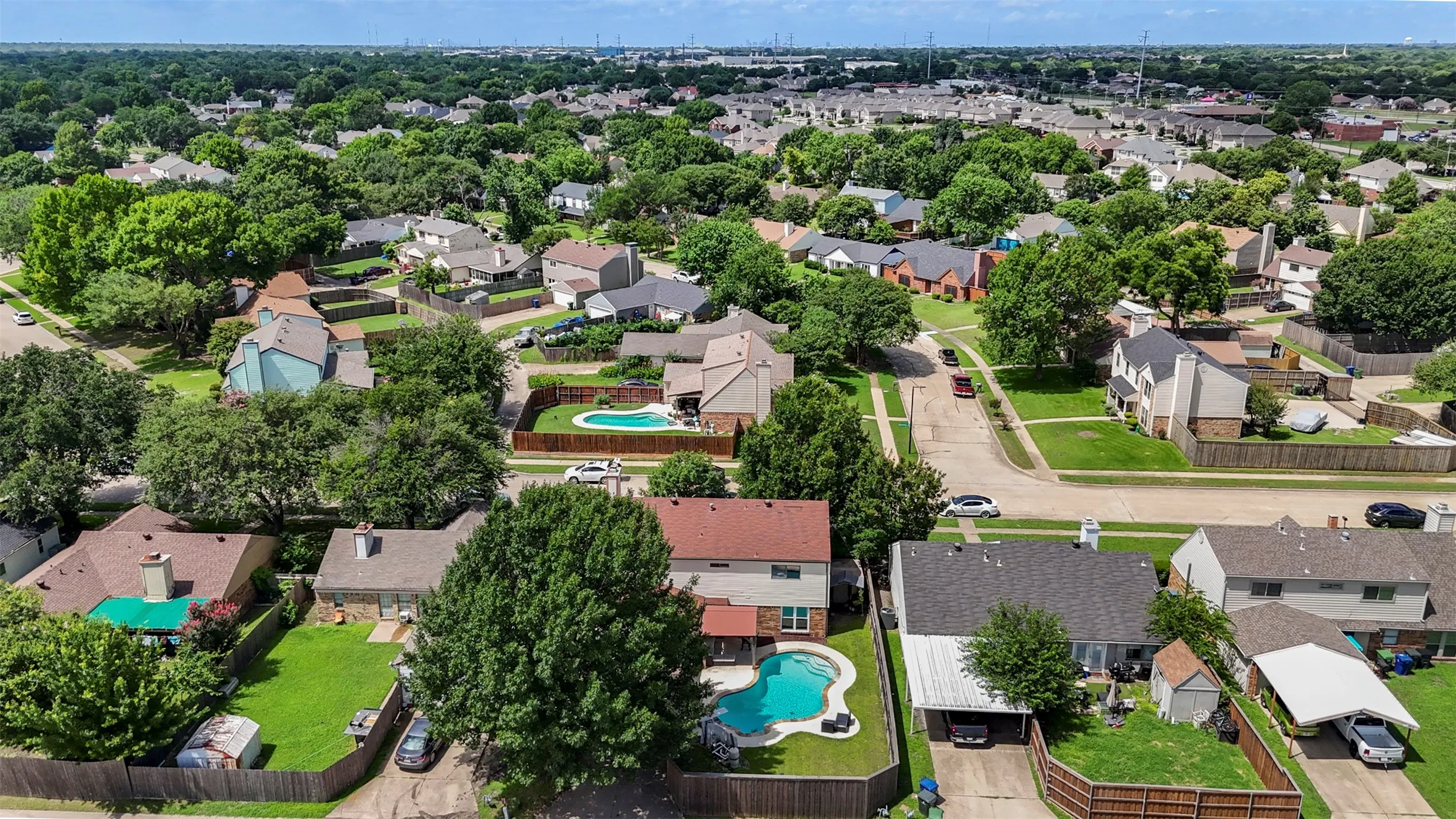 Aerial perspective showcasing a residential neighborhood with numerous single-family homes