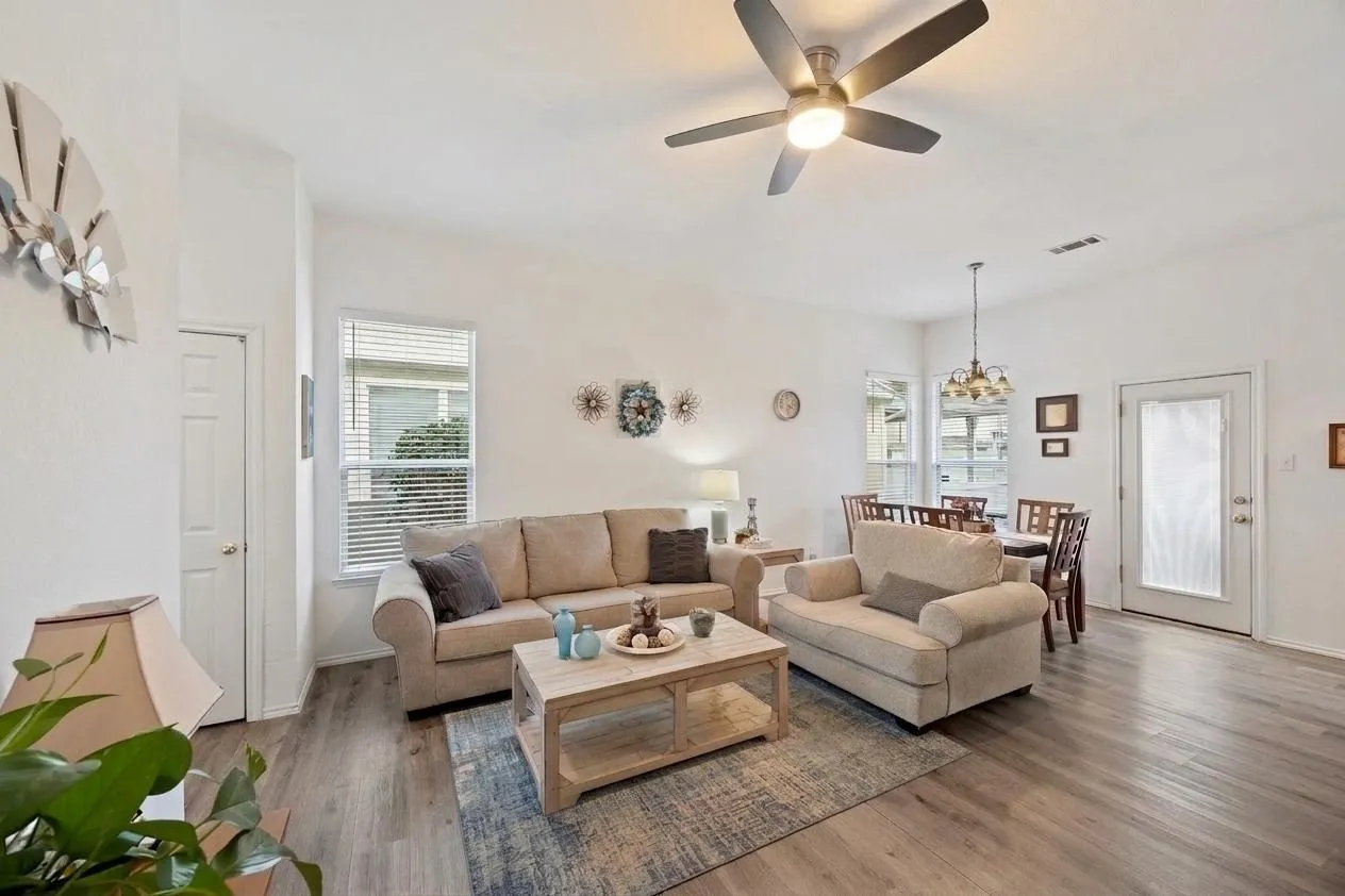 Light living room with a small view of dining.