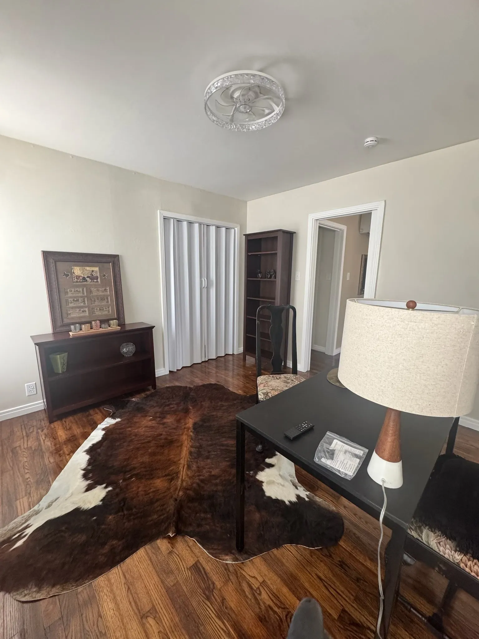 Rich wood-finish flooring complements light-toned walls