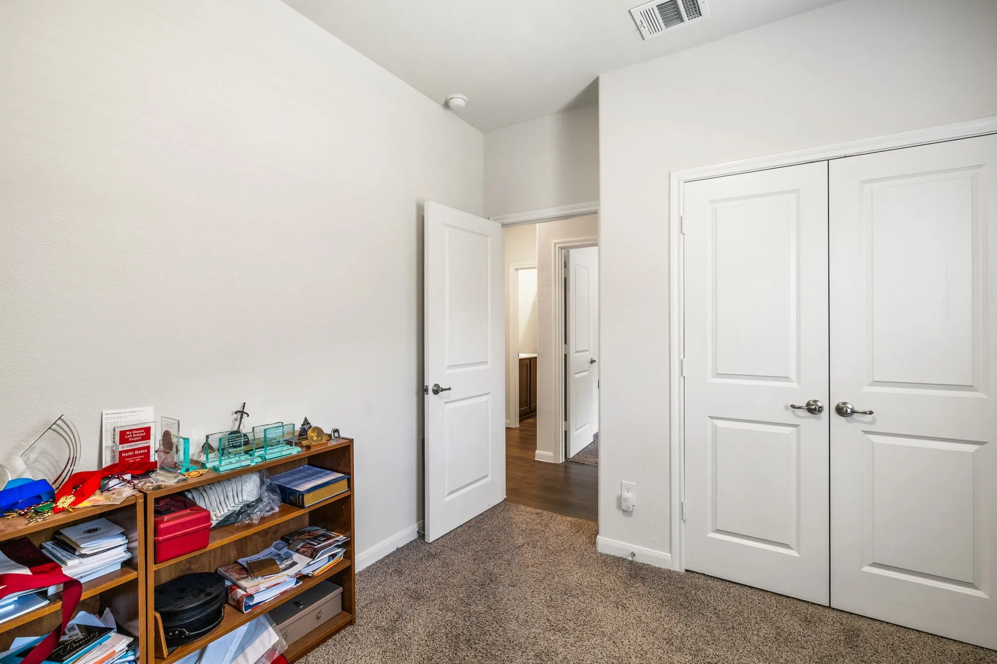 Bedroom #3 - currently used as private office space featuring carpet flooring and large window.
