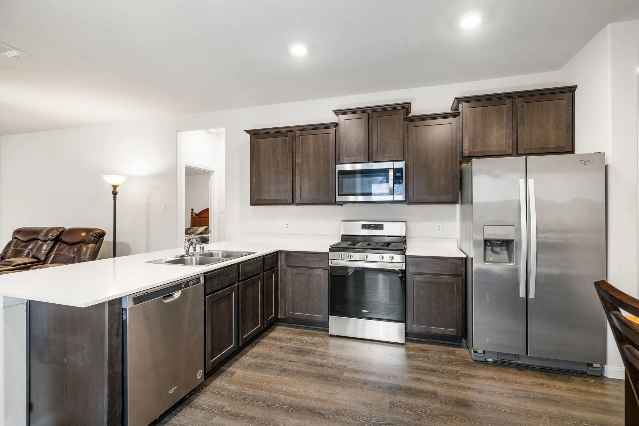 Meal prep is a breeze in this kitchen featuring gas range, built-in microwave, and tons of cabinet space.