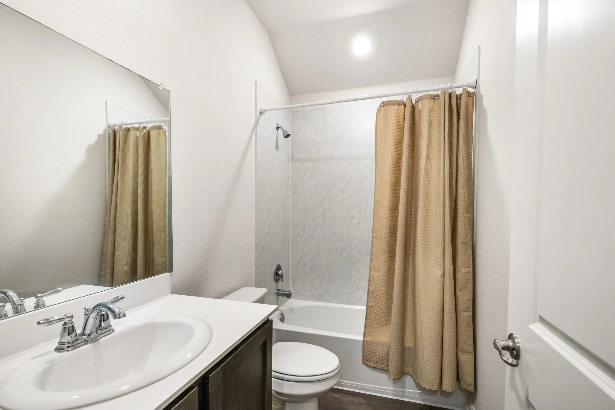 Full bath with vanity, shower / bath combination