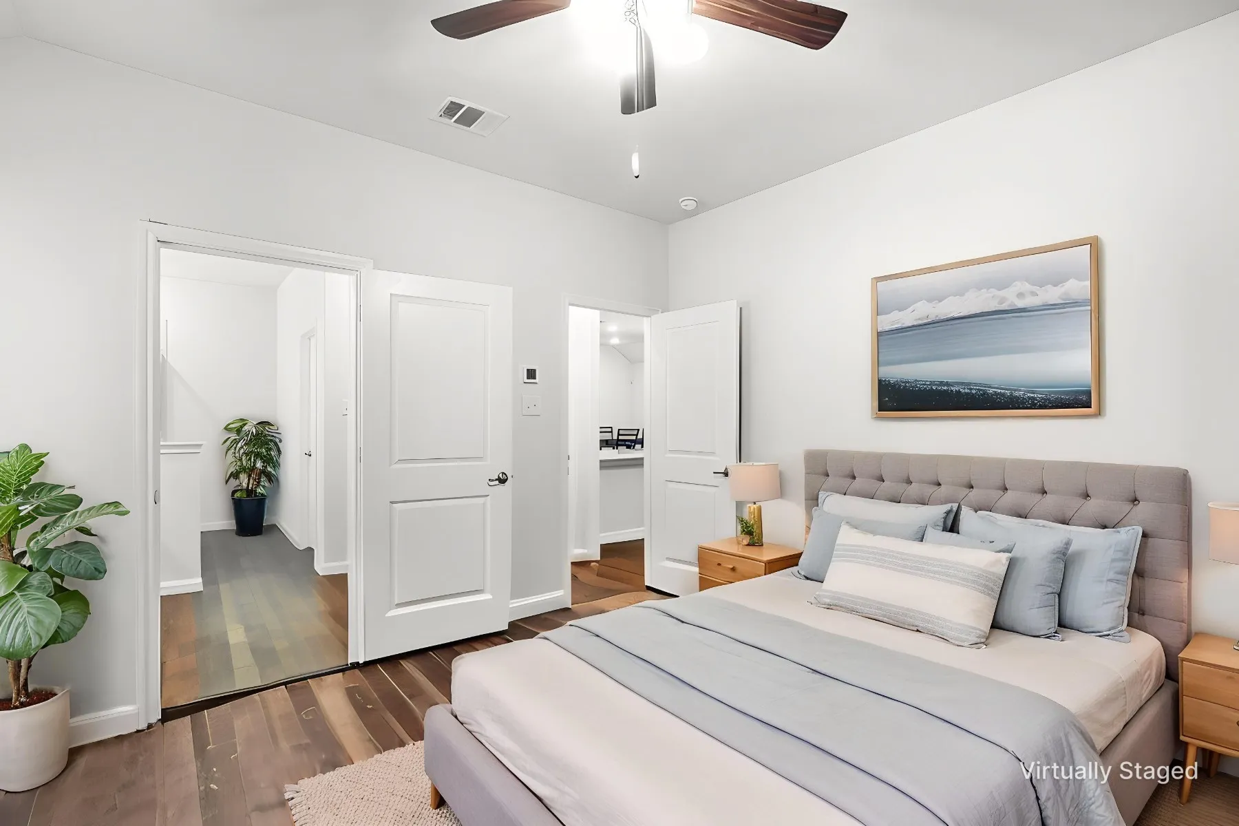 Virtually staged - View as Primary bedroom featuring carpeted flooring, lofted ceiling, ensuite bath, and a ceiling fan