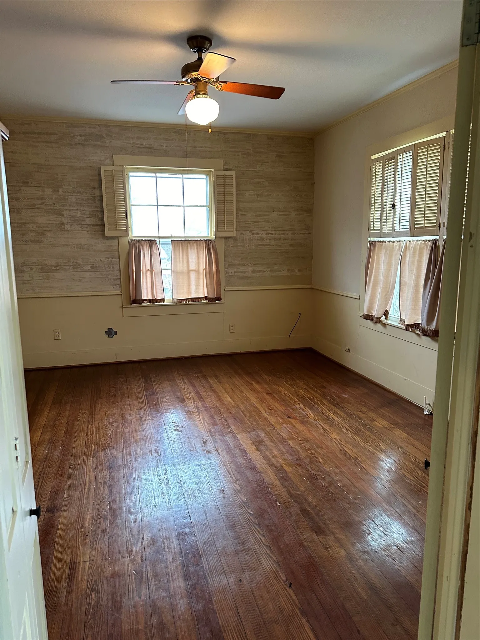 Hardwood flooring throughout featuring natural graining