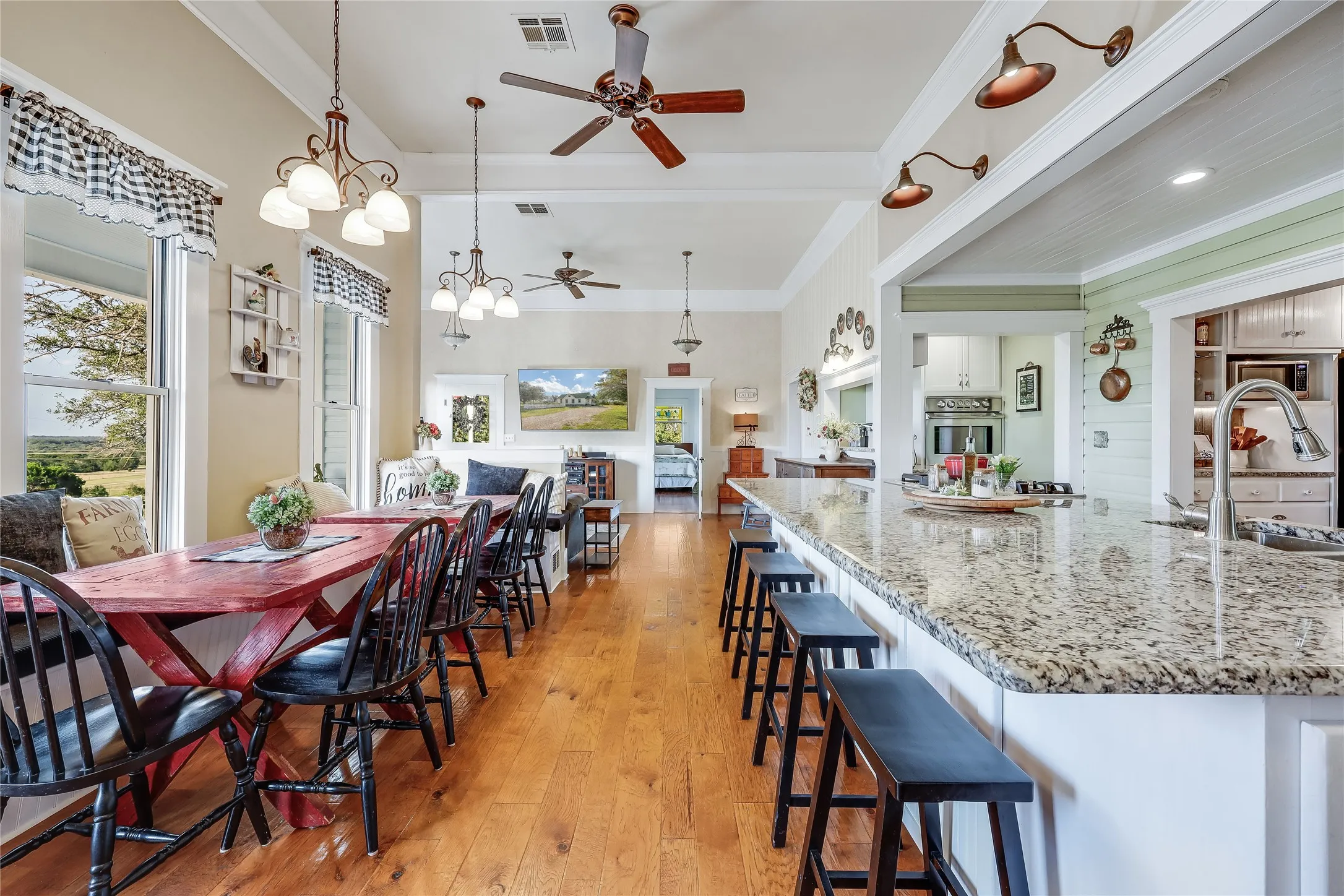 Open-concept living space with wood-finish flooring
