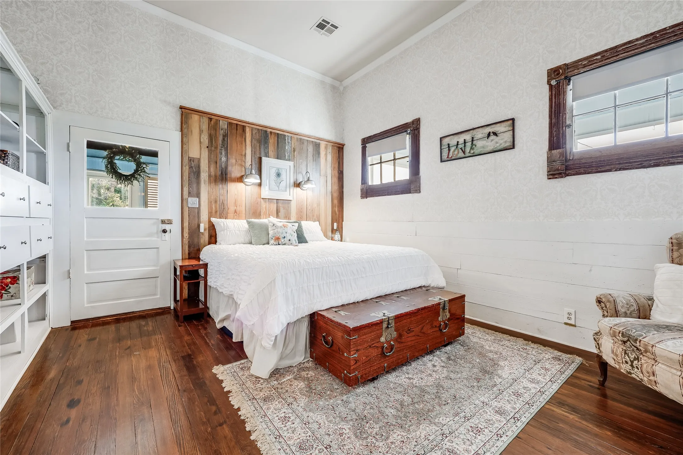 Bedroom featuring wood-finish flooring and a decorative area rug