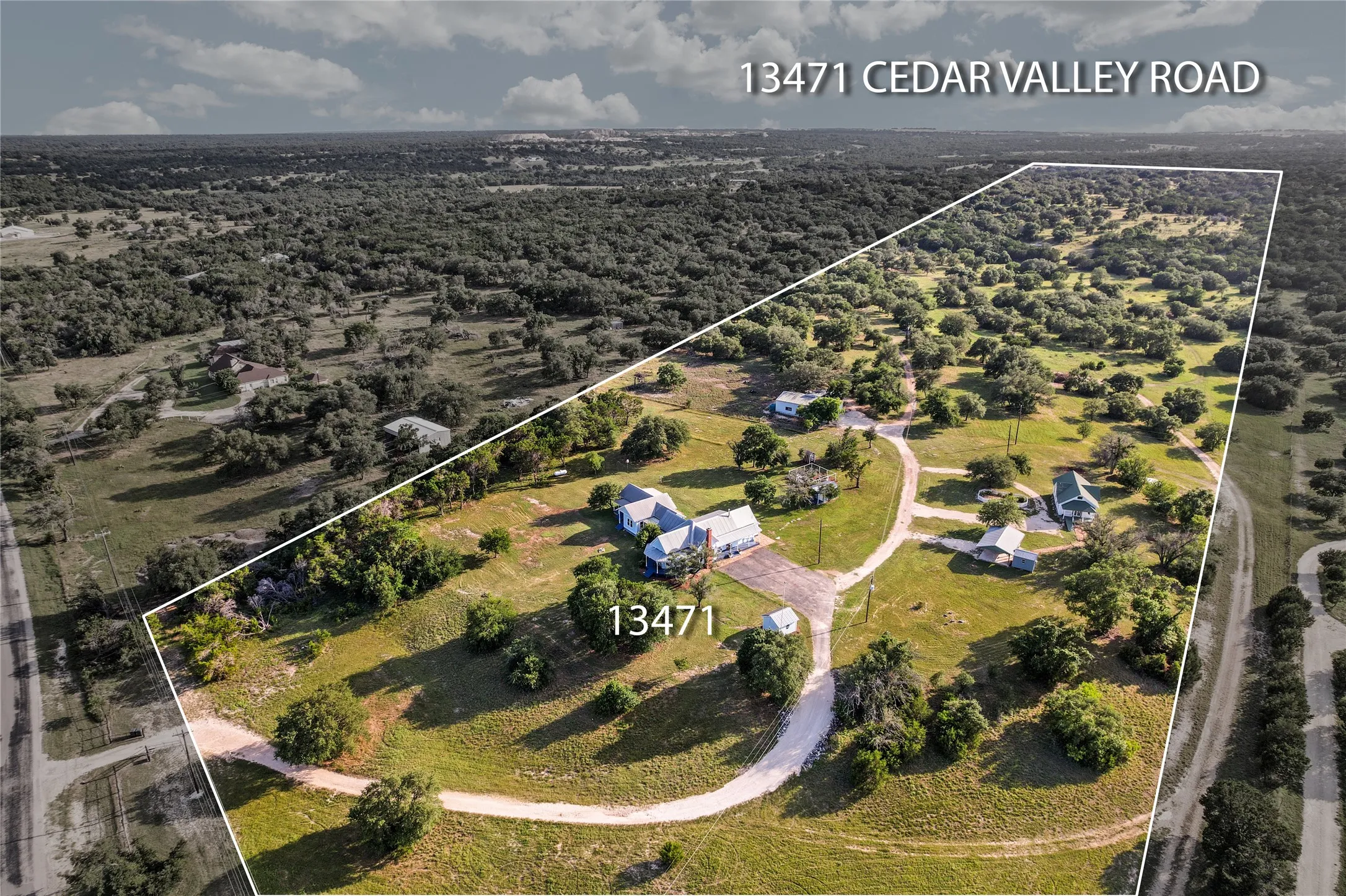 Expansive property featuring multiple structures and mature tree coverage