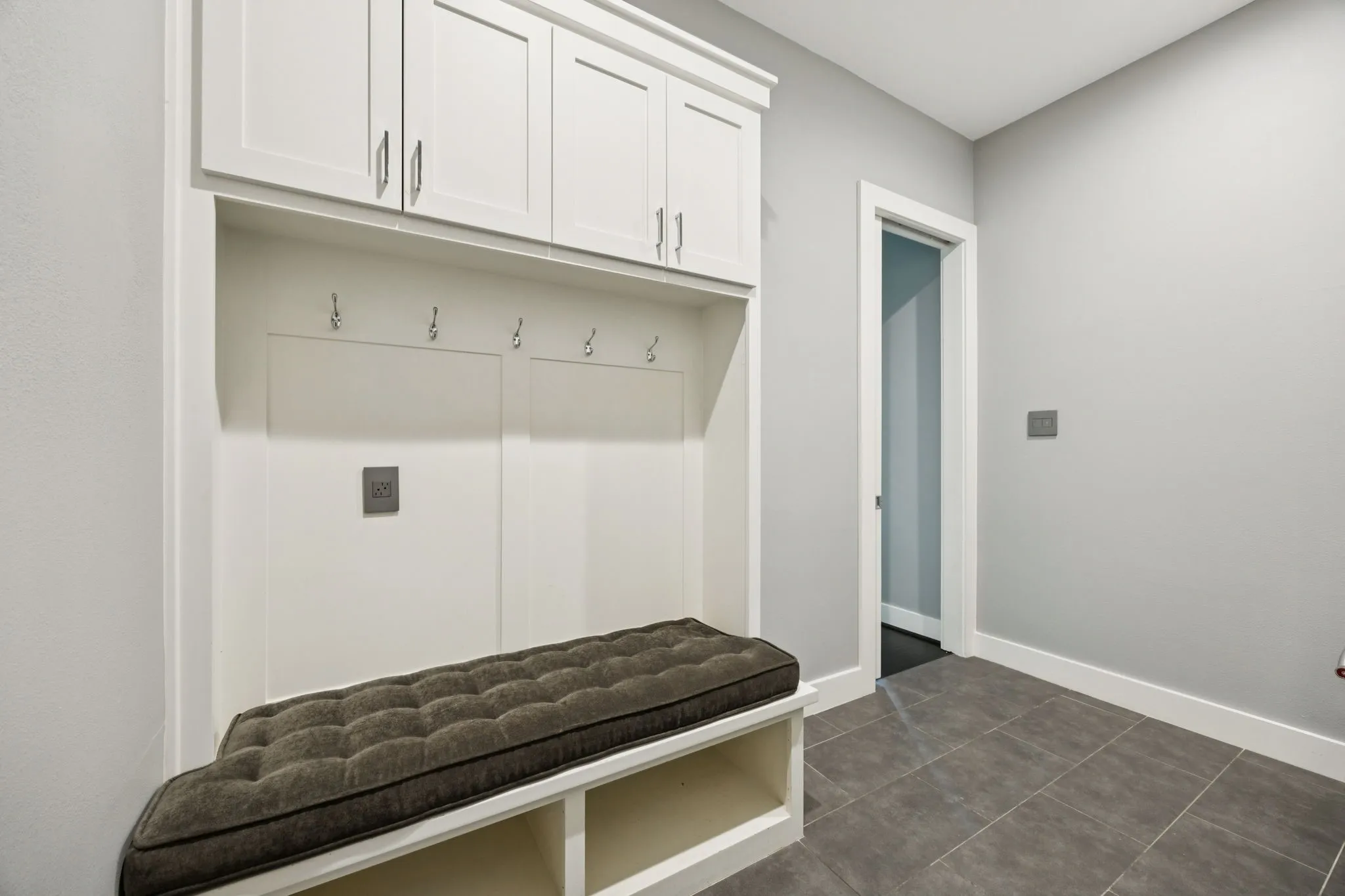 Mud room tucked away in the laundry room