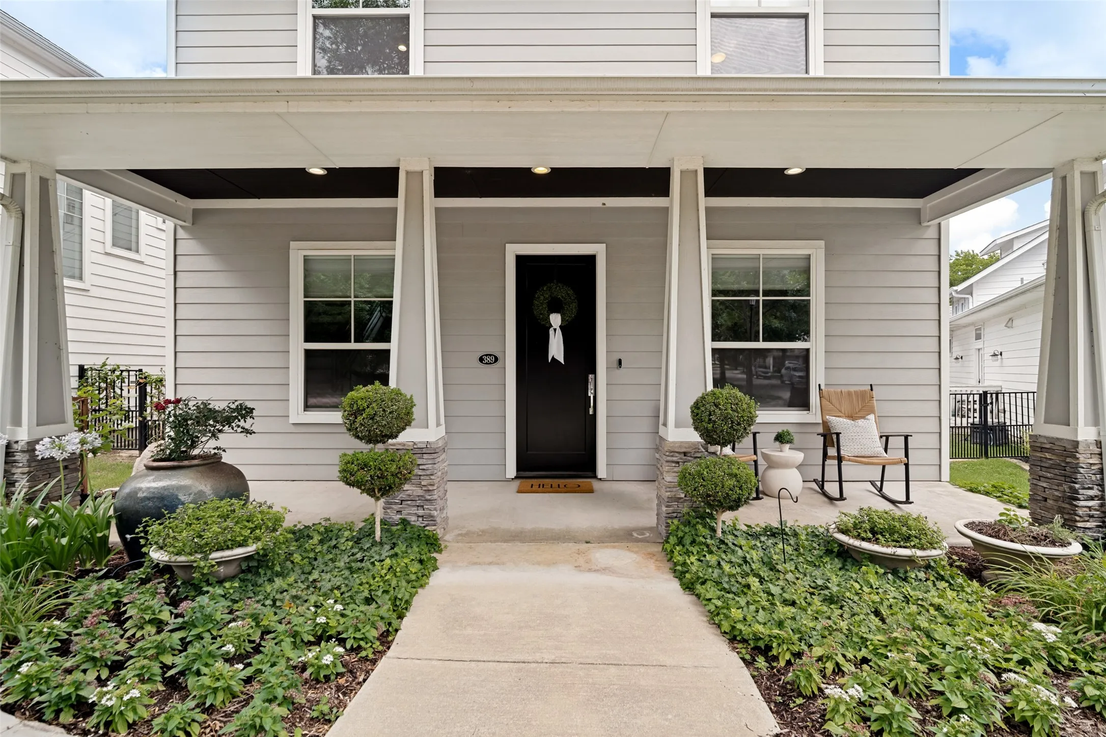 Charming covered front porch welcomes you home