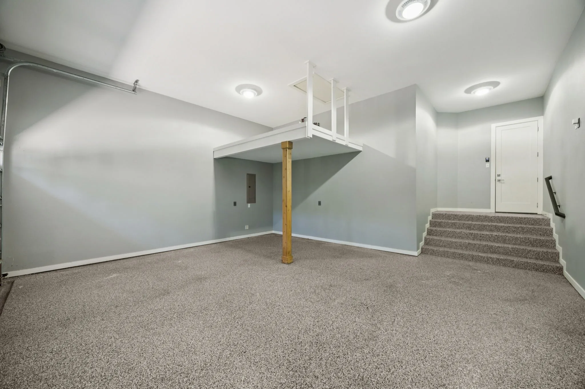 Oversized 2 Car garage with epoxy flooring and extra storage space