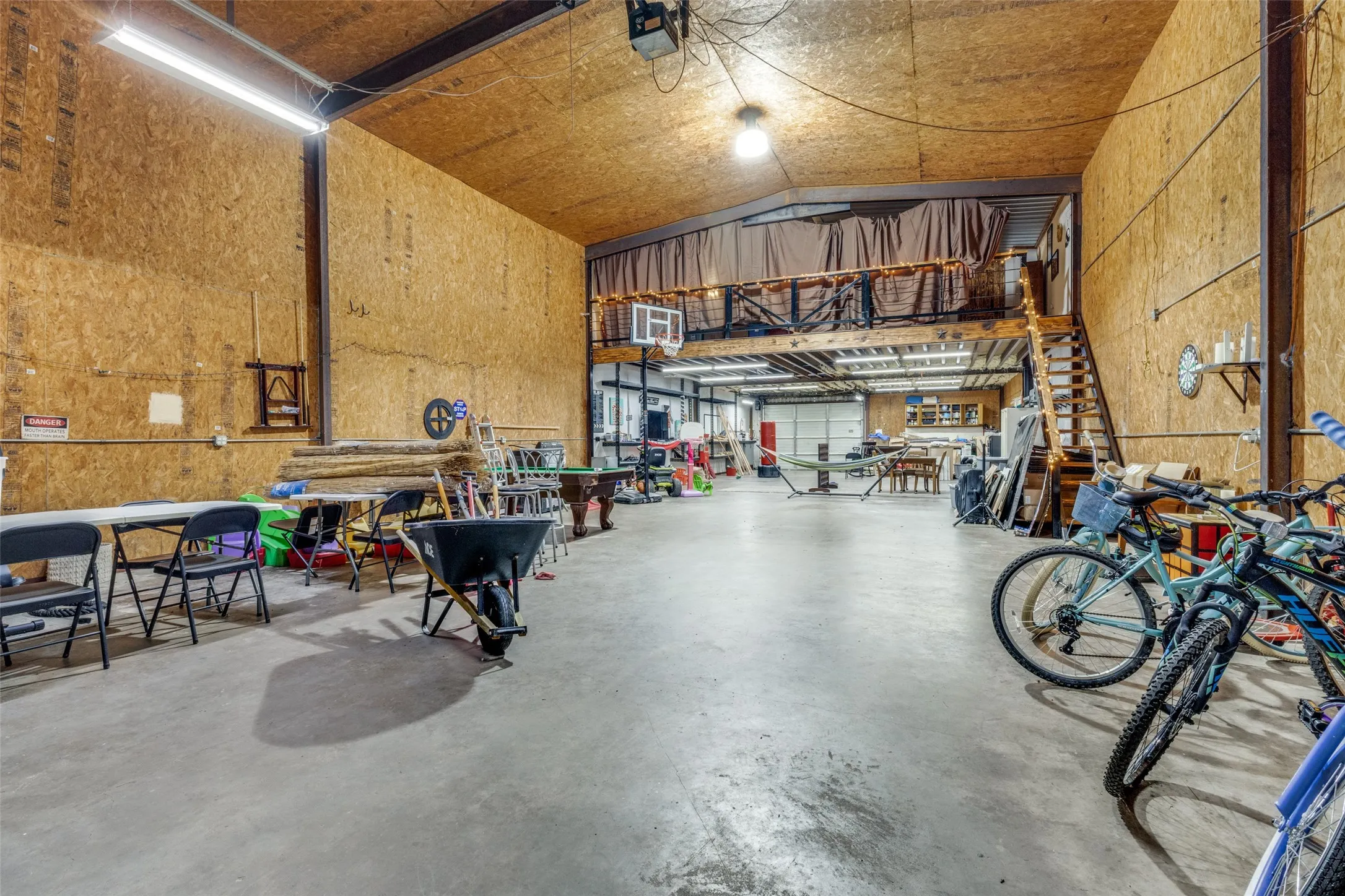 Garage with a garage door opener and a workshop area
